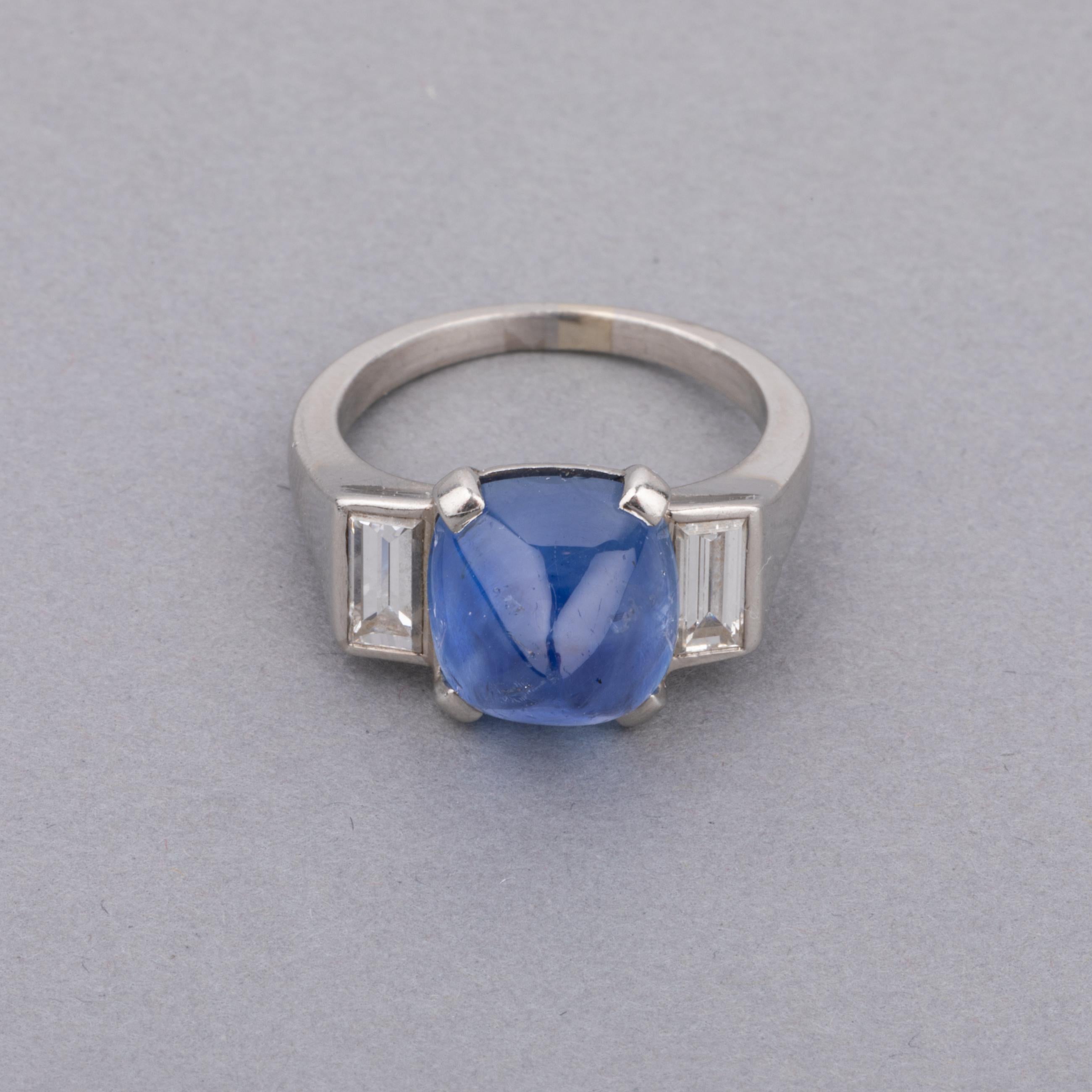 One very lovely ring, made in France circa 1930 by Mauboussin.
Made in platinum and set with an approximately 5 carats sugar Leaf Sapphire. Two baguettes diamonds and the side. The sapphire has good clarity and sweet blue color.
Ring size: 52 or 6