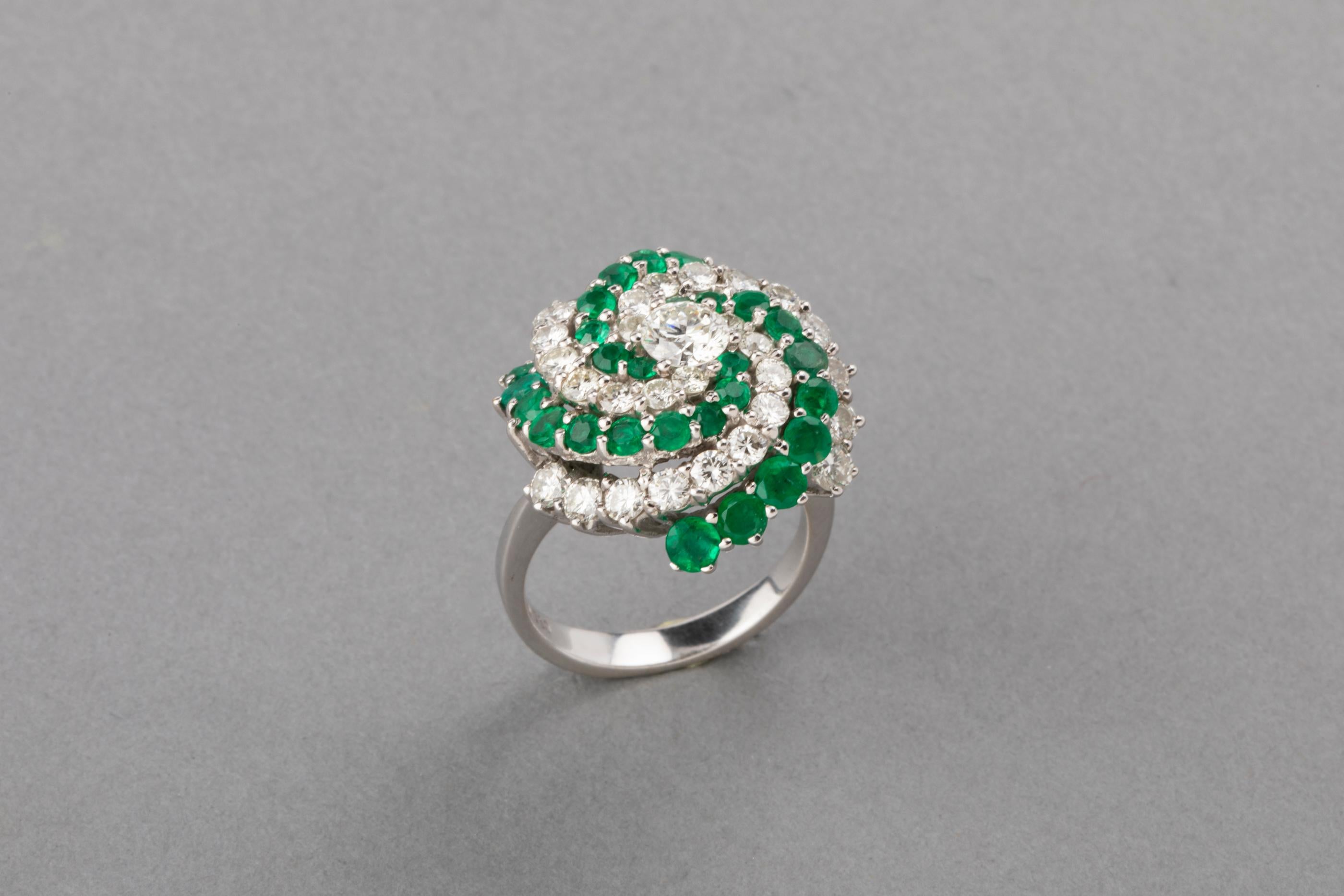 5 Carats Diamonds and 4 Carats Emeralds Set

Very beautiful set. 
Made in white golf 18k, marks fort gold 750.
The total weight of diamonds is 5 carats. For the ring the bigger one is 0.50 carats, the others weight 1.50 estimate. For the earrings