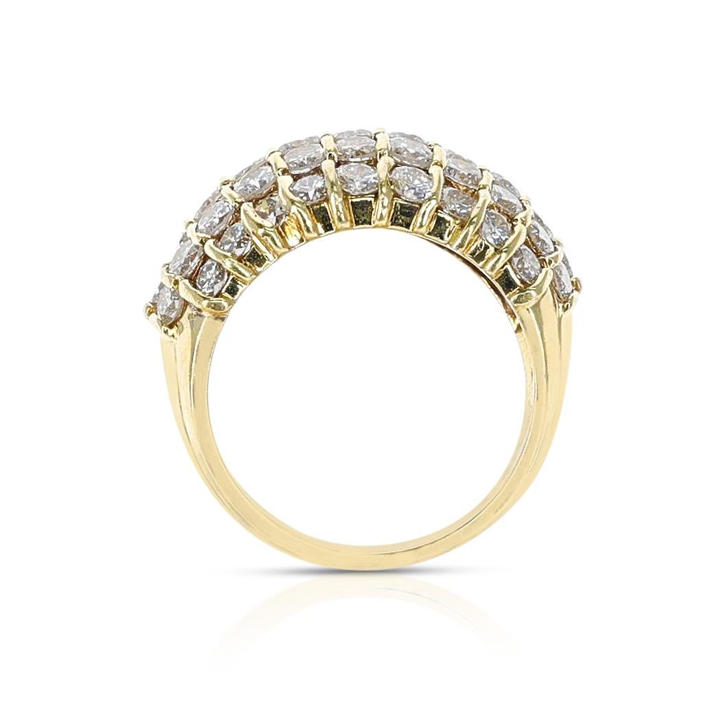 A Five Row Round Diamond Bombe Cocktail Ring made in 18 Karat Yellow Gold. The total weight of the ring is 12.15 grams. The ring size is 6.75 US.  