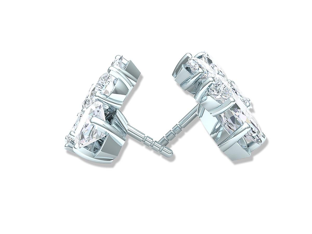 A classic and stunning array of Marquise and Pear diamonds.  The stars of the show in these earrings are a 1 carat to .90 carat Marquise cut diamond that's white F-G-H color VS-SI1 clarity. The large marquise are complimented by five other stunning