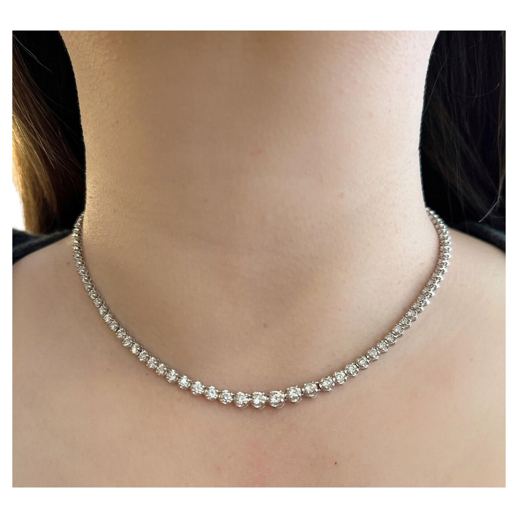 5.00 Carats Round Diamond Riviera Necklace in Platinum

Diamond Riviera Necklace features 111 Round Brilliant Cut Diamonds set in slight graduated style in a Platinum setting.

Total diamond weight is 5.00 carats. All diamonds are bright and lively