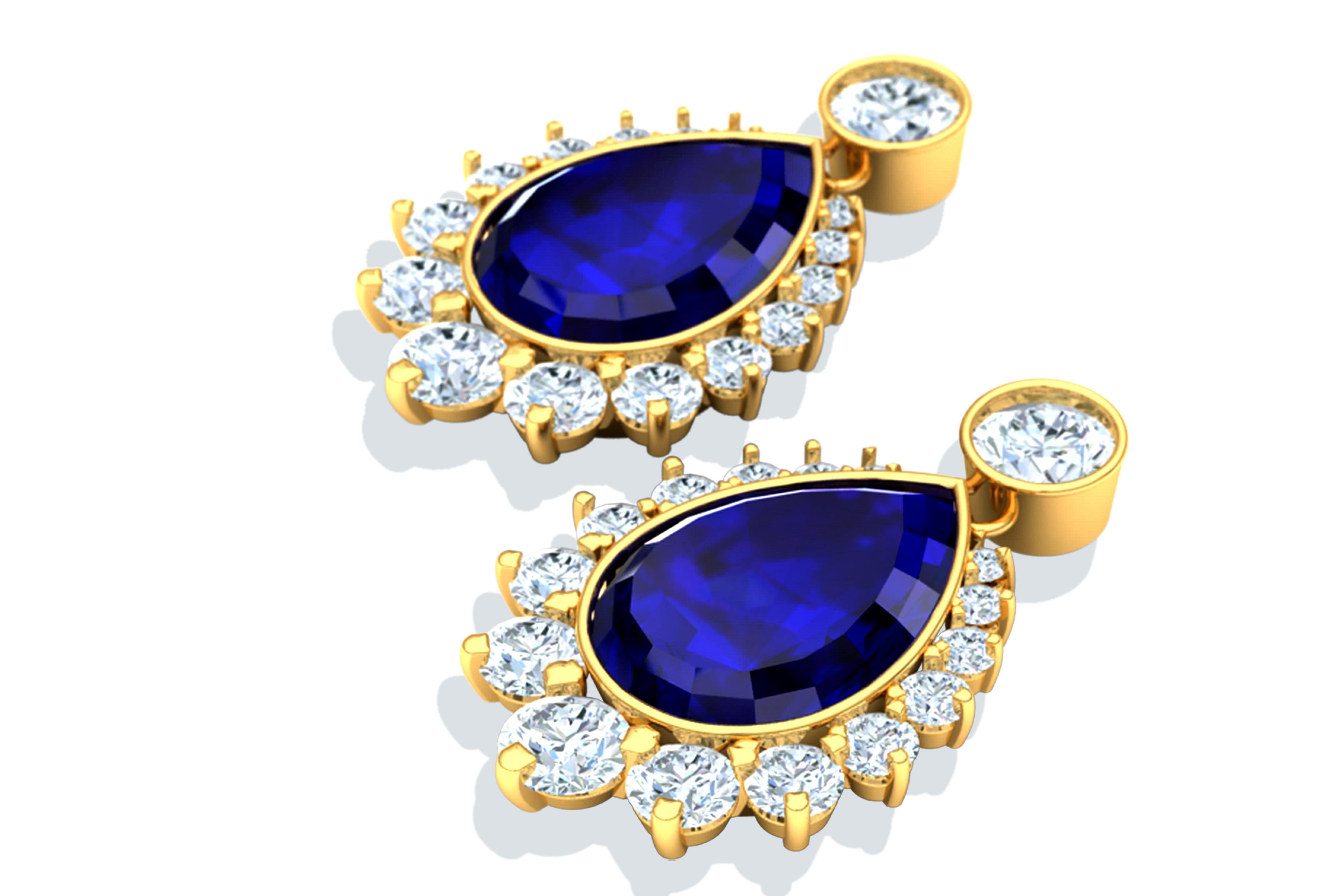 These drop Tanzanite and diamond earrings contain the following.  Two pear cut AAA Tanzanites that are deepest hues of violet and blue with peaking amounts of red when the light hits it right.  These pear shape Tanzanites are complimented by over