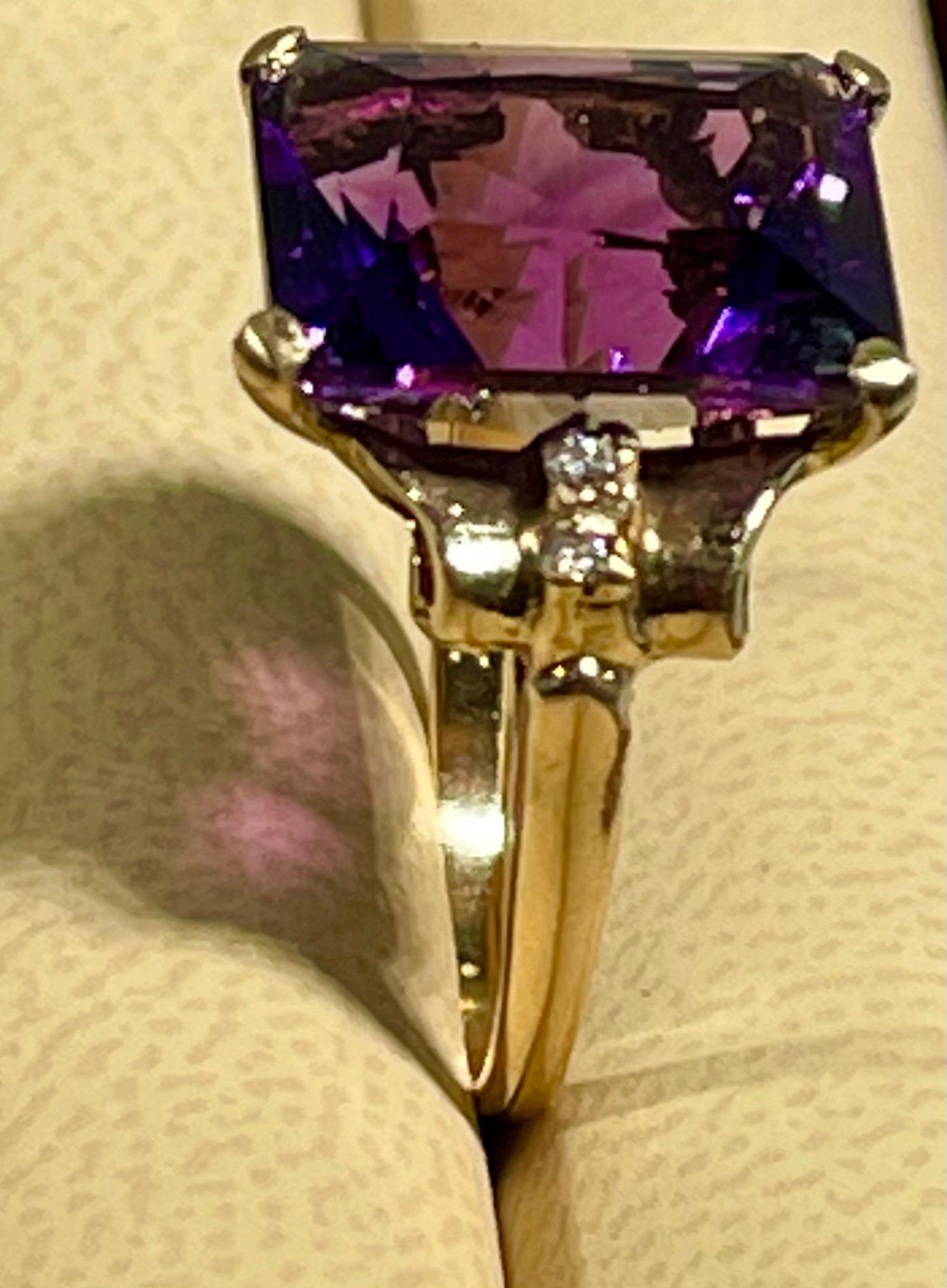 12 x 14 MM Amethyst and Diamond Cocktail Ring in 14 Karat Yellow Gold Size 5 1/2

This is a Beautiful Cocktail ring ring which has a large approximately 5 carat of  Amethyst . Color and clarity is nice. 
Emerald cut  Amethyst.
just 4 tiny round