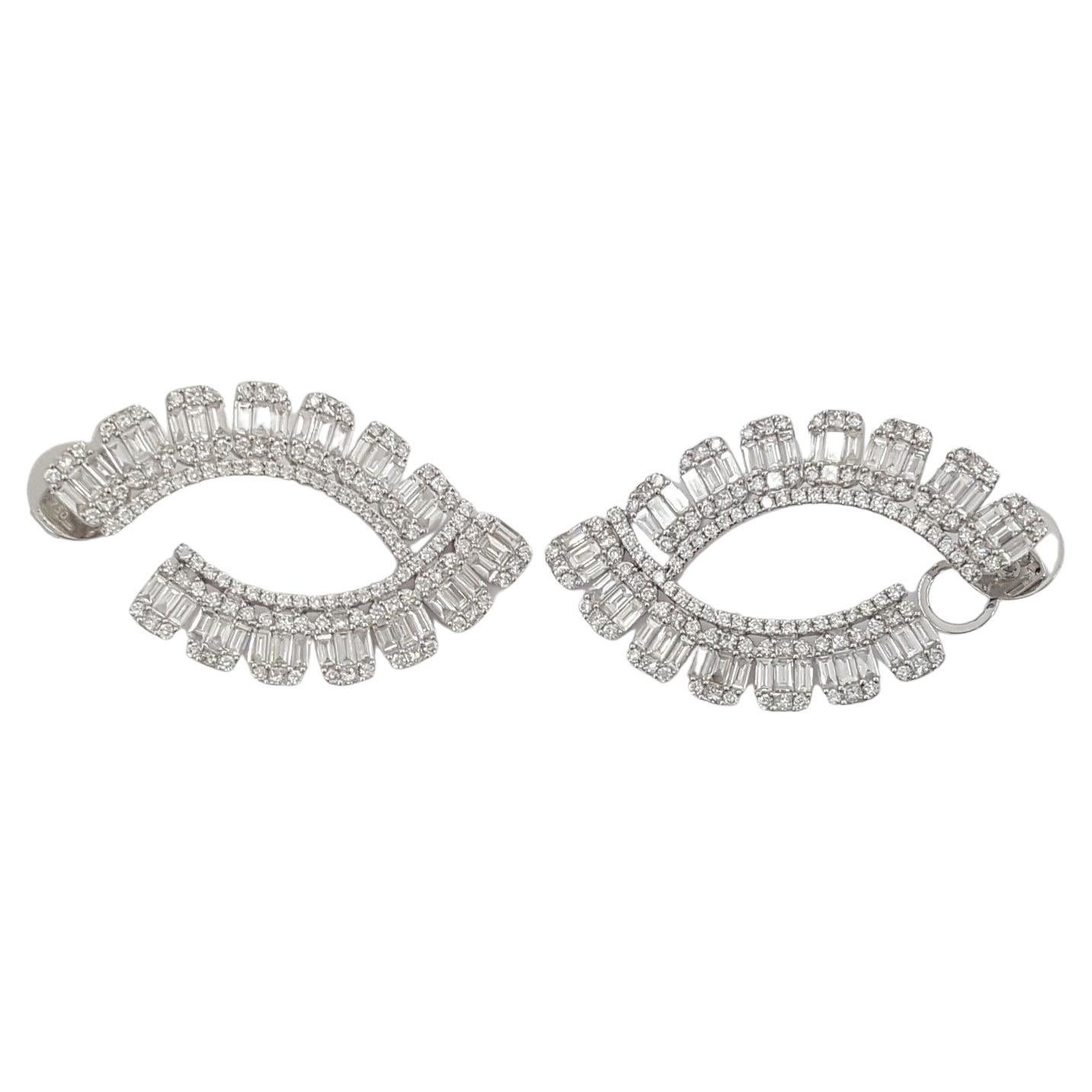 An exquisite pair of baguette and round brilliant cut diamonds hoop earrings 



