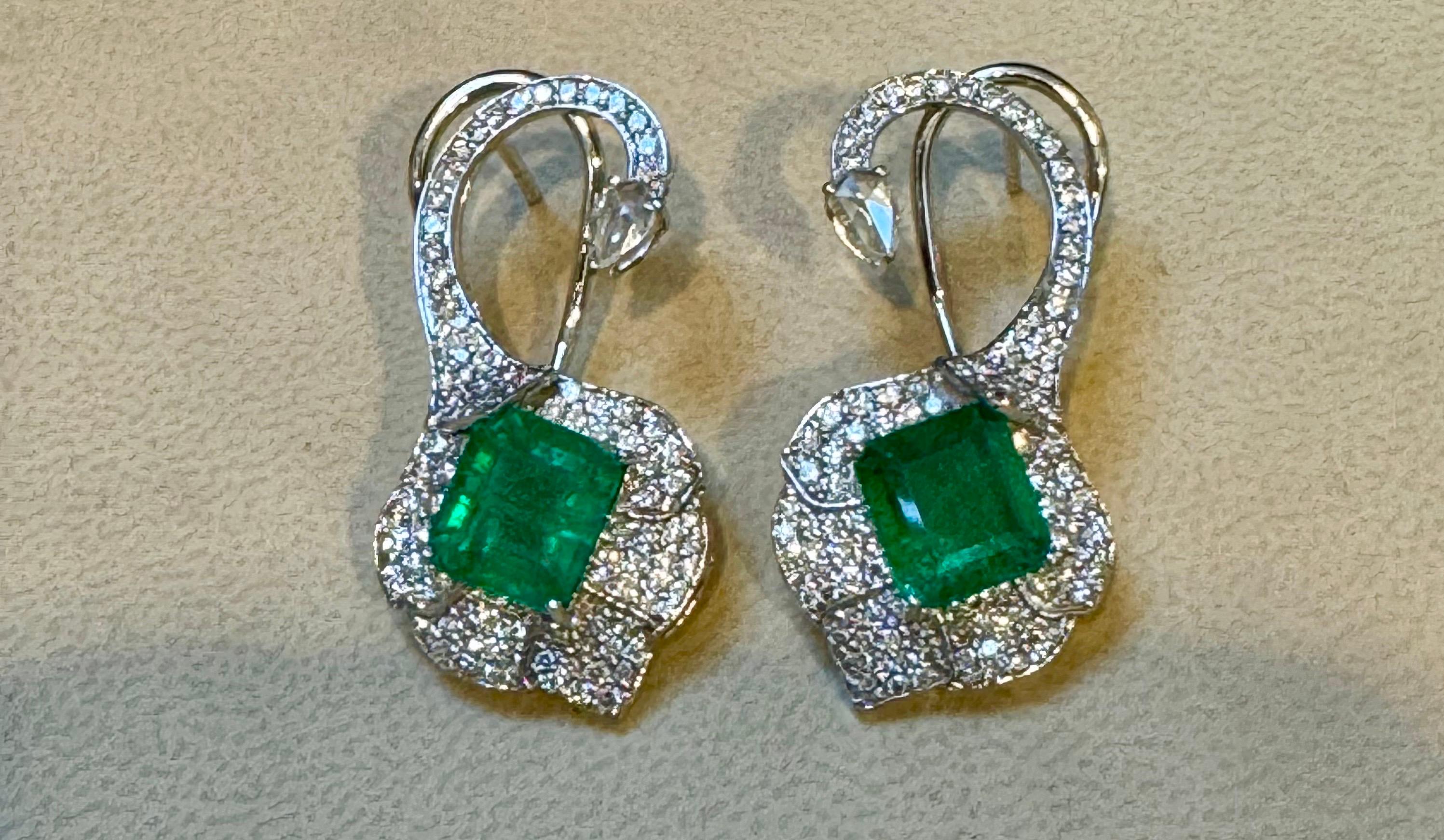 5 Ct Natural Zambian Emerald cut Emerald Earring & 2 Ct Diamond , Rose cut Diamond Earring
 
This exquisite pair of earrings are beautifully crafted in 18 Karat white gold
Weight of 18 Karat gold is 9.6 Grams with emeralds
Origin Zambian
Natural
