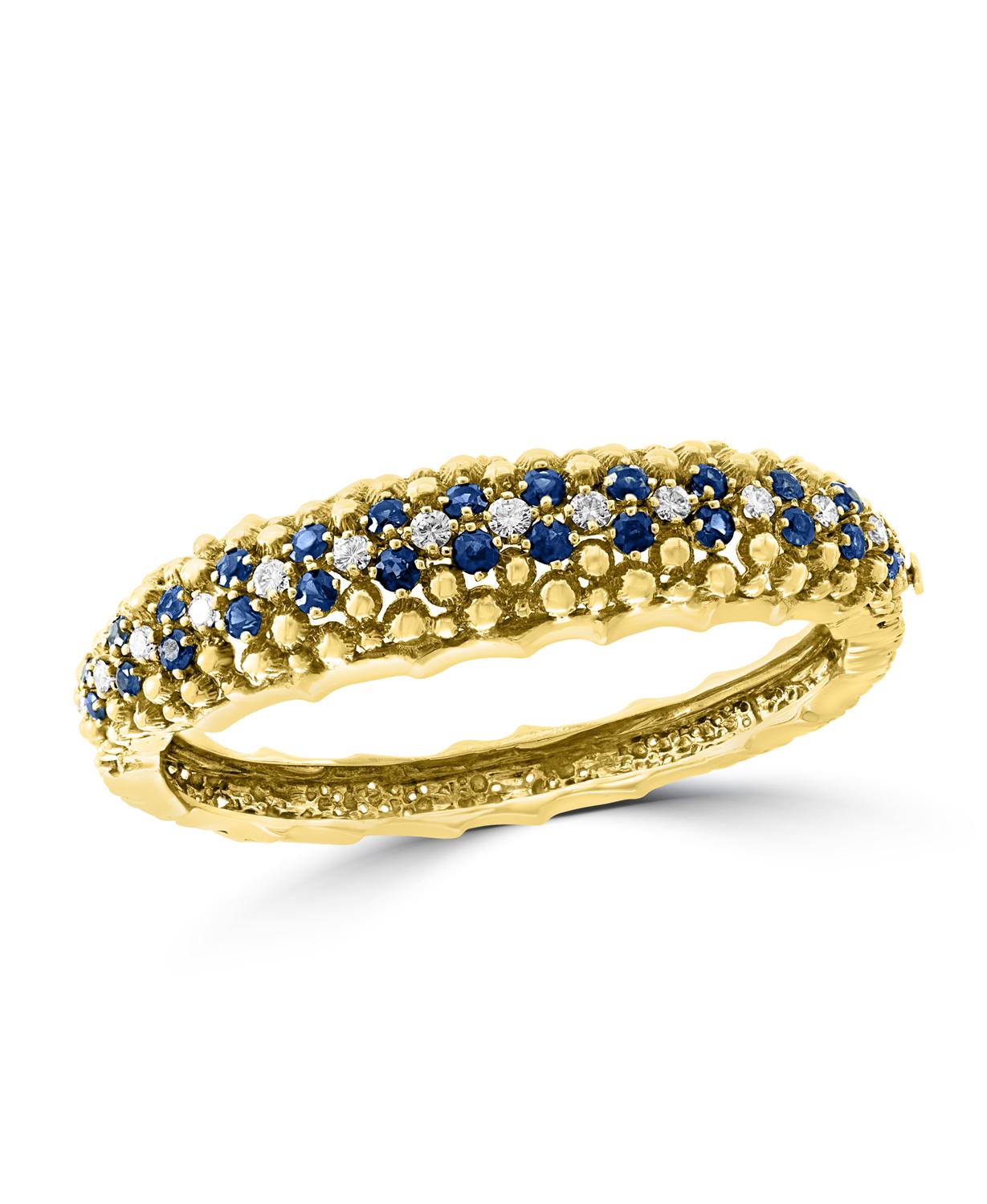 5 Carat Sapphire & 1. 5 Carat Diamond Bangle Bracelet In 18 Karat Yellow Gold 
A spectacular jewelry piece. This exceptional Bangle bracelet has 26 round blue sapphire stone . Weight of the Sapphire is approximately 5 carats. Alternating the