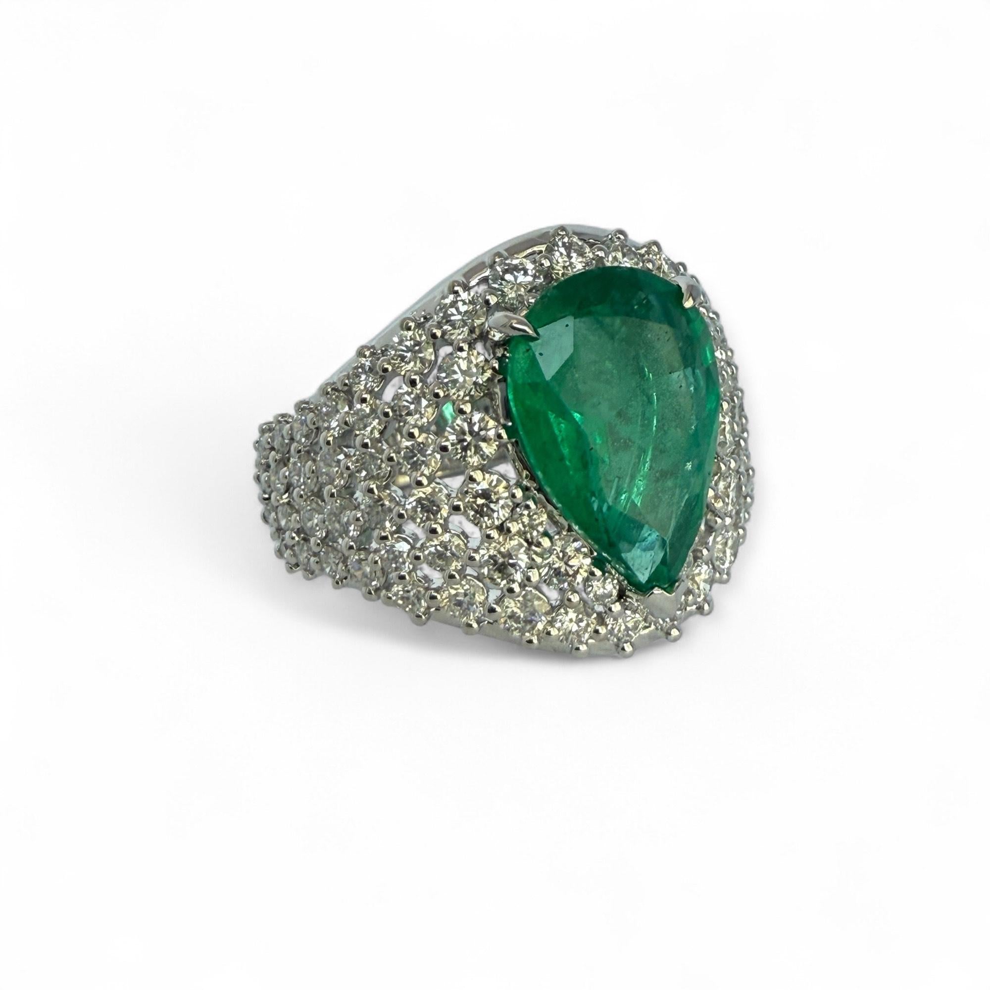 Make a statement with this significant Emerald of almost 5 cts featured in a grid halo of approximately 2 ctw large brilliant cut diamonds. Renowned for our one of a kind precious gemstone collection, this ring is the star of our holiday collection!