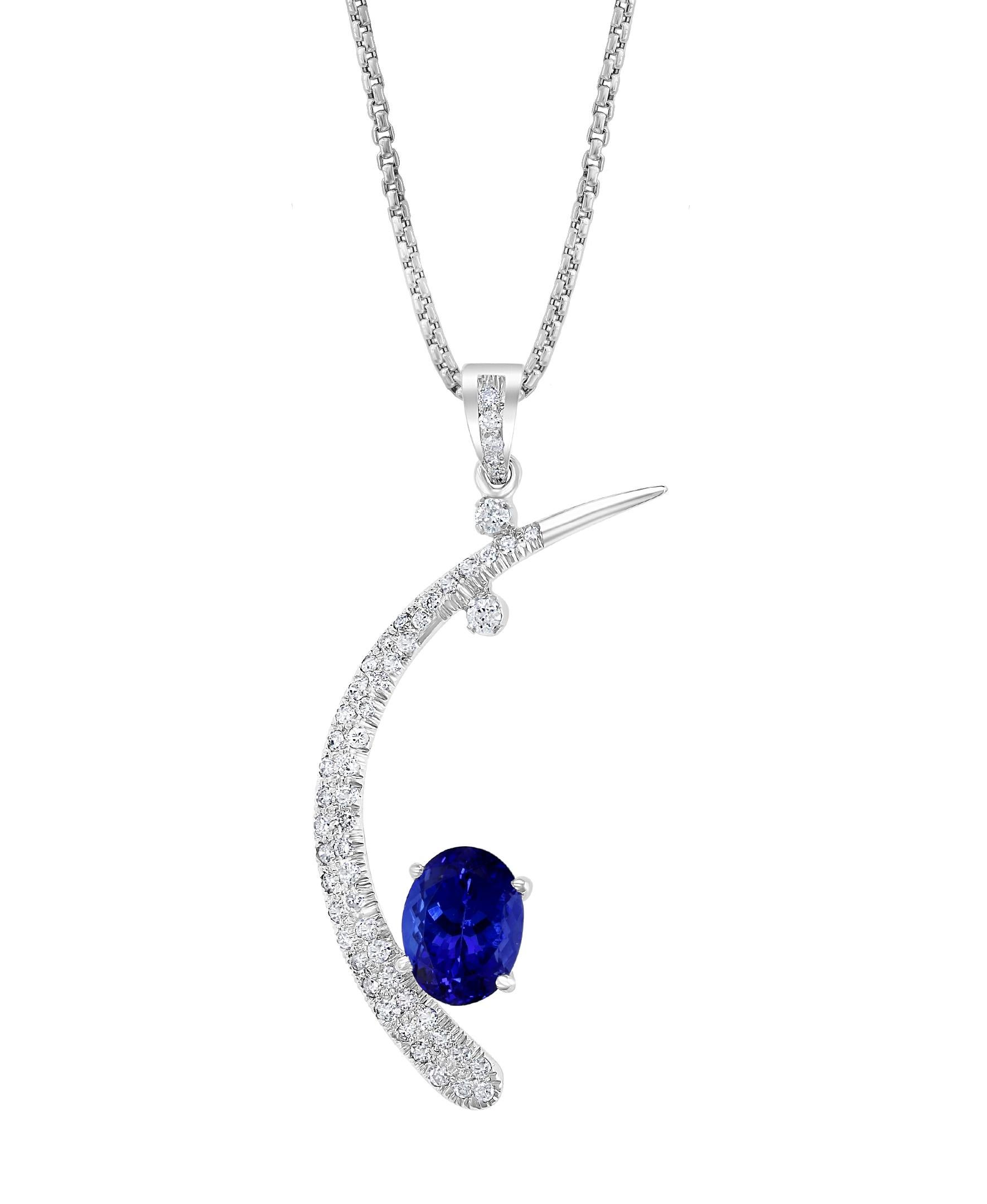 5 carats of fine  quality of  Tanzanite pendant surrounded by brilliant round  cut Diamonds all mounted in 18 karat White  gold. Weight of the necklace is 6 Grams . 
Tanzanite Weight  approximately 5  Carats, AAA quality of Tanzanite , very fine