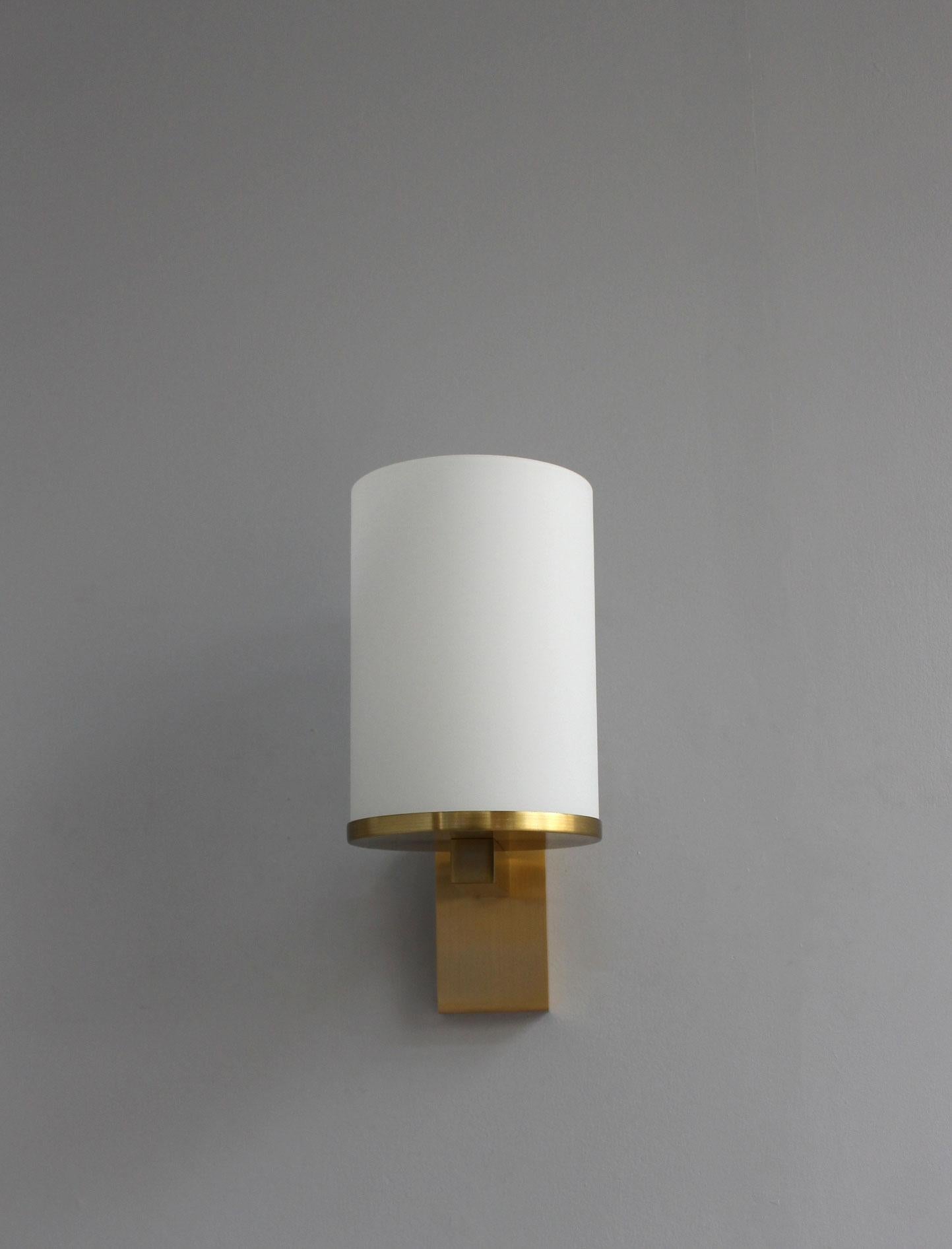 Atelier Perzel - Fine French Art Deco wall light with an enameled glass cylinder shade mounted on a bronze base.

Only one light remains for sale.
 