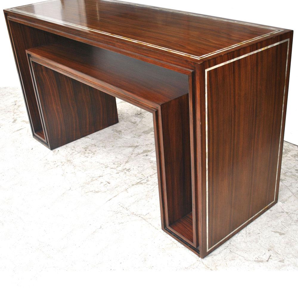 Modern rosewood mother of pearl entry sofa table.

Inlaid mother of pearl paired with a rosewood veneer creates a dramatic entry or sofa table. 
The two-tiered design would make an ideal workspace and computer storage unit. 

Measures: 60
