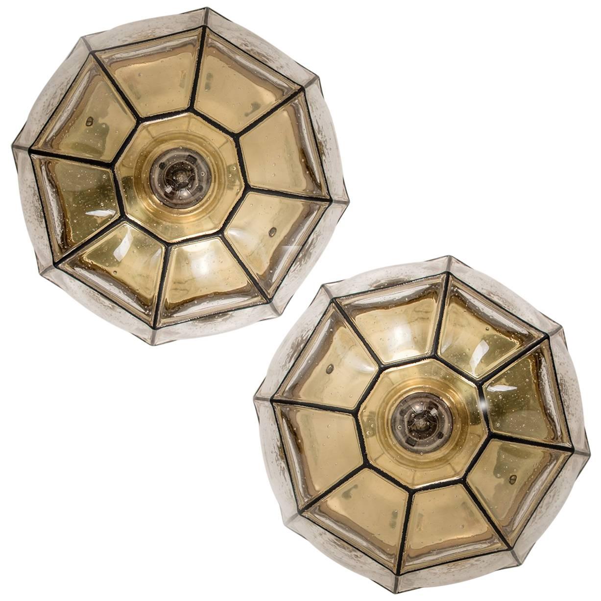 This beautiful and unique octagonal set of glass light flushmounts or wall lights were manufactured by Glashütte Limburg in Germany during the 1960s (late 1960s or early 1970s). Beautiful craftsmanship. Each lamp, made from elaborate clear glass