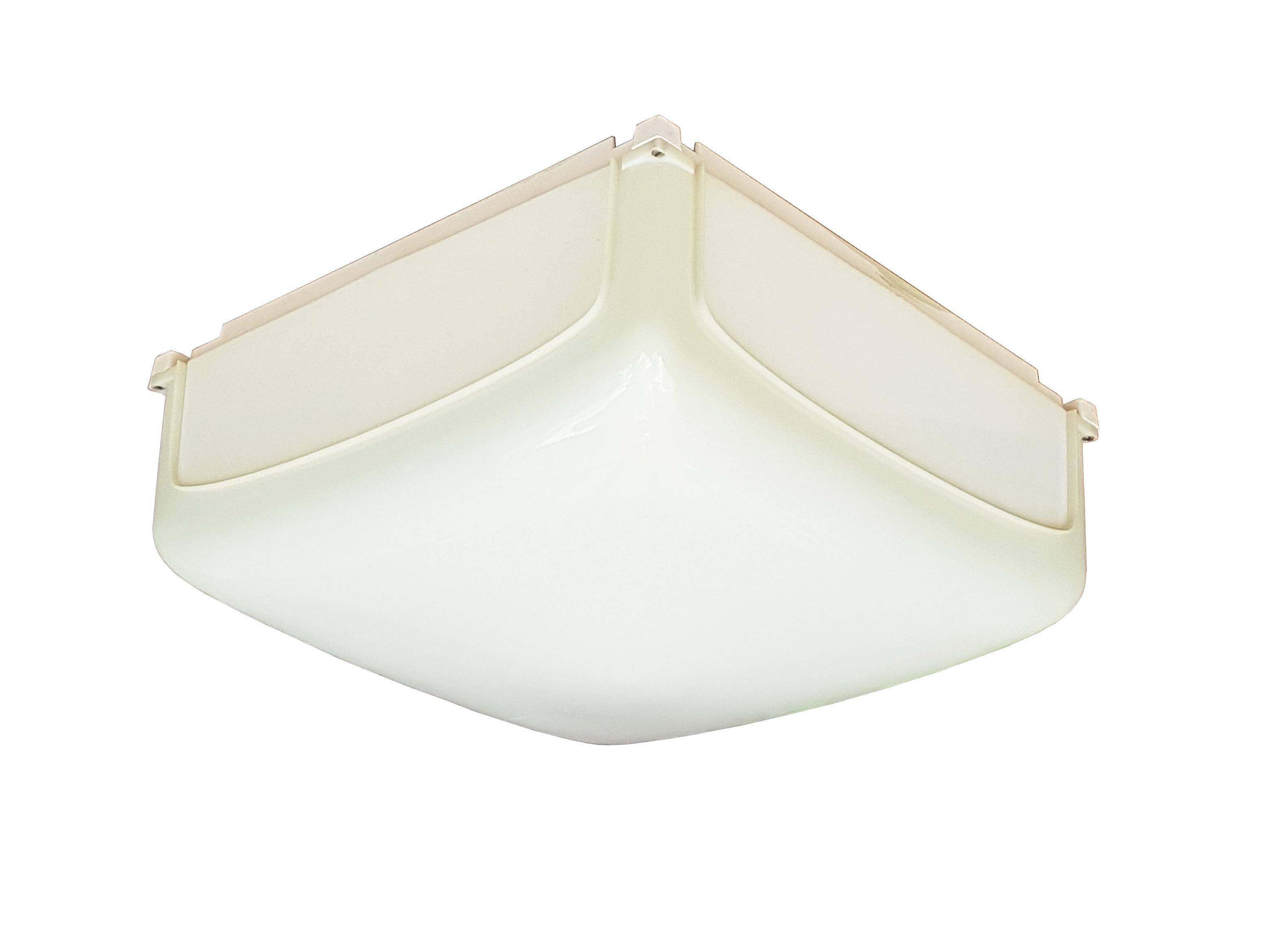 Set of 5 plastic ceiling or wall lamps designed in 1969 by Angelo Mangiarotti and produced by Artemide. The lamps can be combined to form a light panel of various shapes or placed separately. Originally the plastic was white in color, but due to
