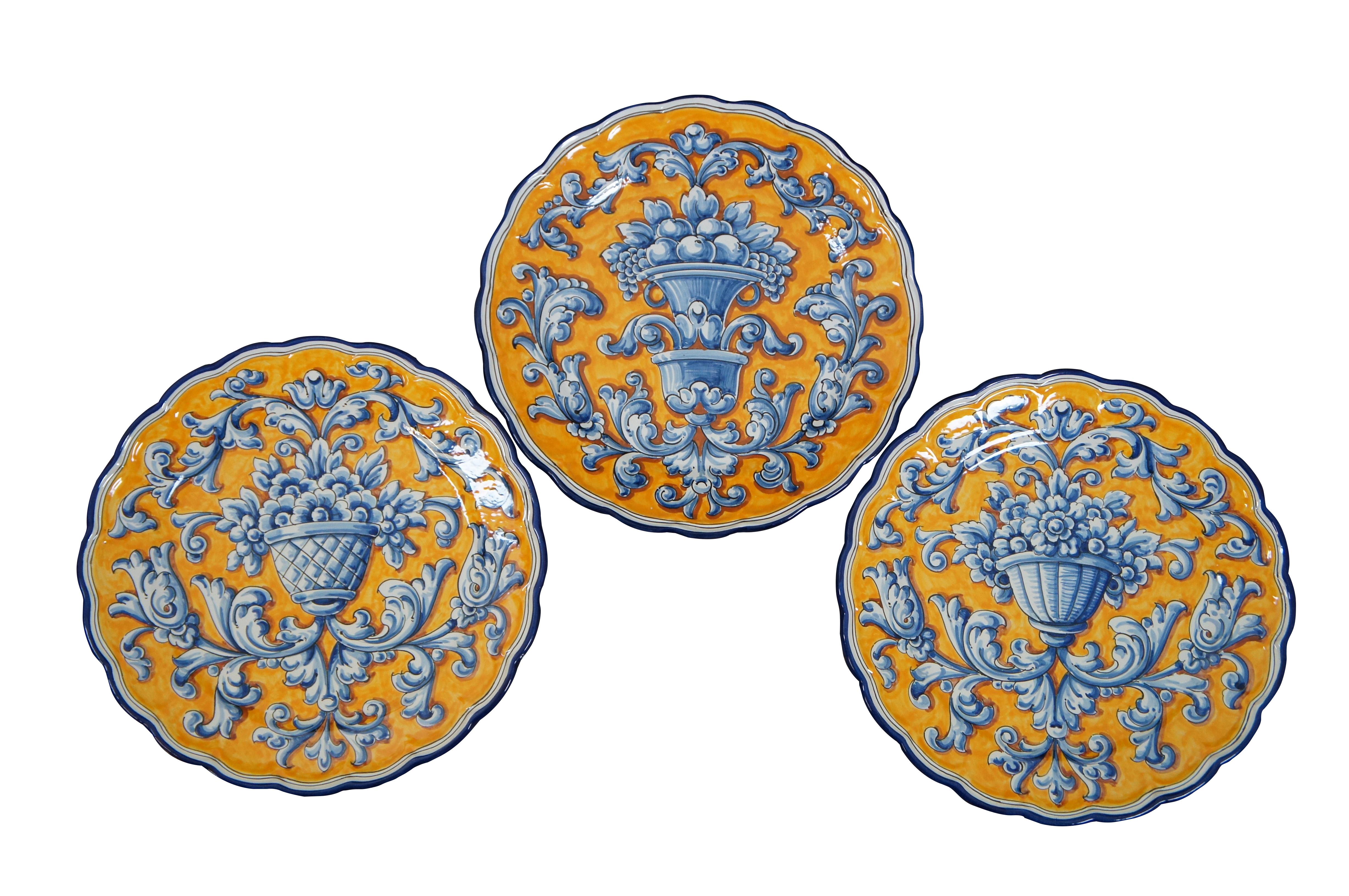 Set of 5 vintage Mexican / Spanish folk art pottery platters / chargers by J.A. Froilan. All platters are the same size, round with lightly scalloped edges and drilled holes in the back edge for wall hanging / display.  All feature slightly