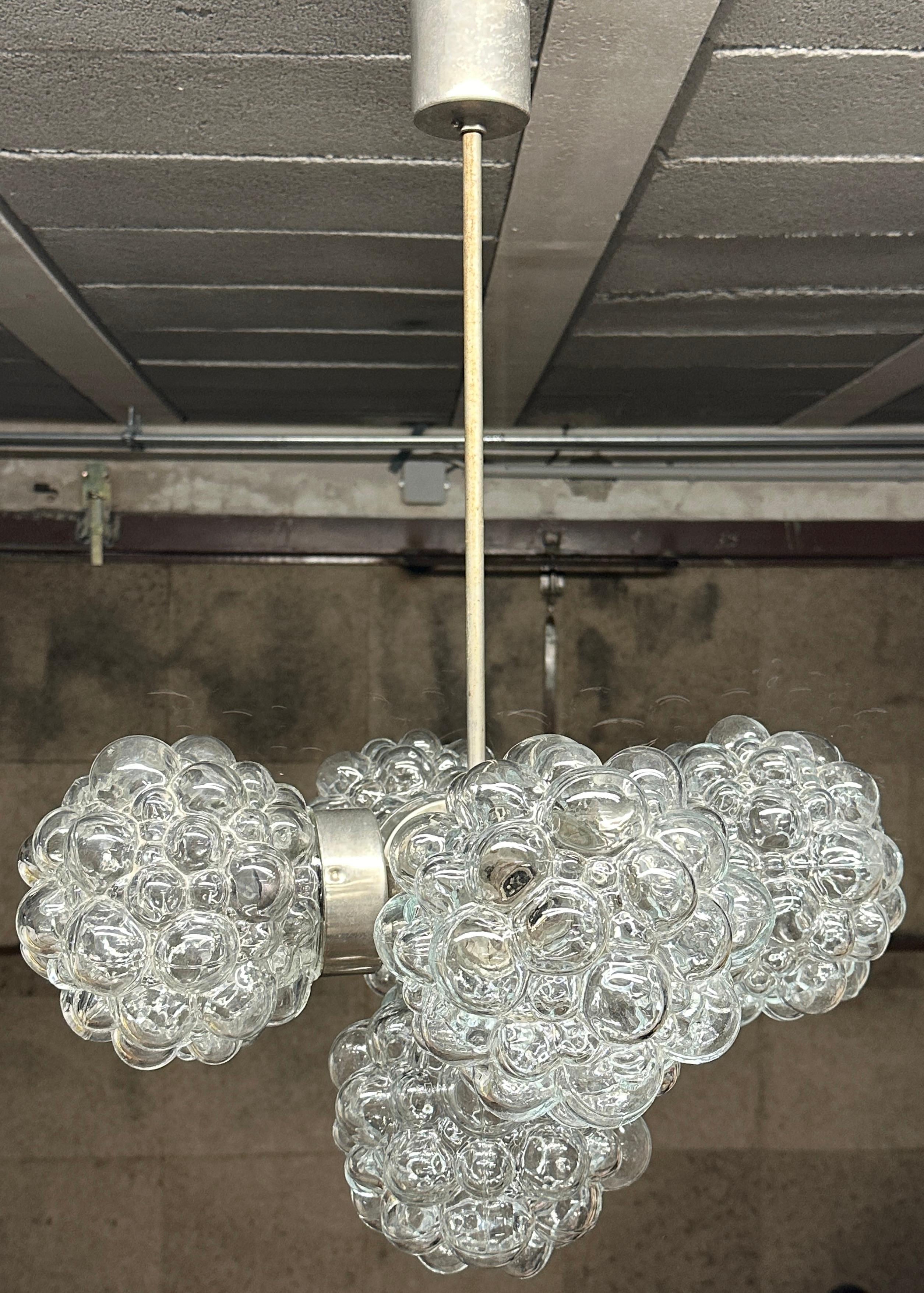 A stunning bubble glass Sputnik Orbit 5 Light Chandelier in the design of Helena Tynell and Heinrich Gantenbrink, found at an Estate Sale in Austria, made circa 1960s - 1970s. The chandelier requires five European E14 / 110 Volt Candelabra bulbs,