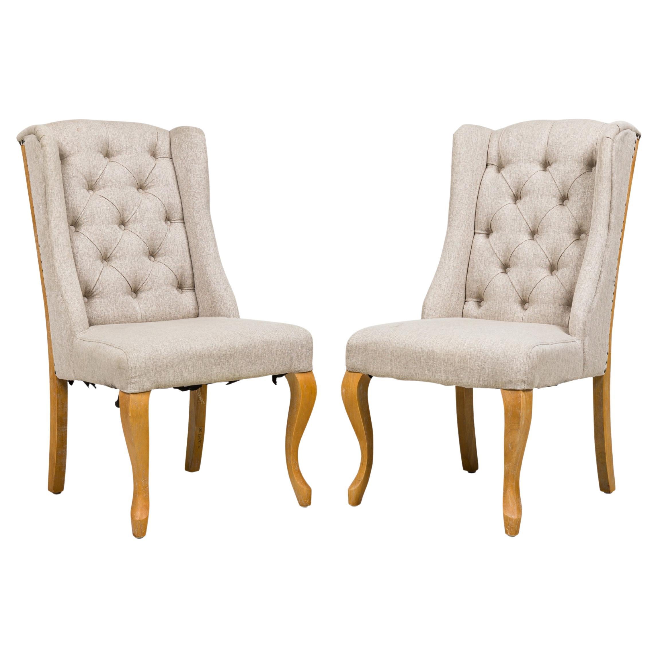 5 Contemporary American dining side chairs with wing-style sloped backs, button tufted light gray woven upholstery, gun metal gray nailhead trim, standing on 2 cabriole front legs and splayed back legs. (PRICED EACH).