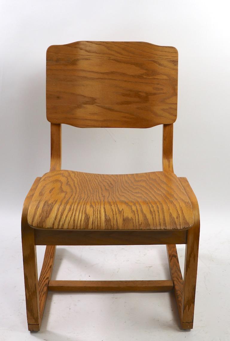 3 Mid Century  Constructivist style plywood chairs attributed to Thonet. These chairs are built to commercial grade standards and can be used for either commercial or residential application. One interesting aspect of the chair is the continuous leg