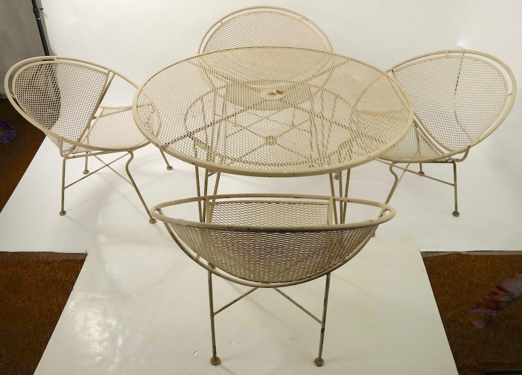 Rare Salterini Orange Slice patio set to include 4 chairs, and 1 table. The set is in good original condition, showing only the expected cosmetic wear to finish, normal and consistent with age.
Useable as is, or we can provide custom powder coating