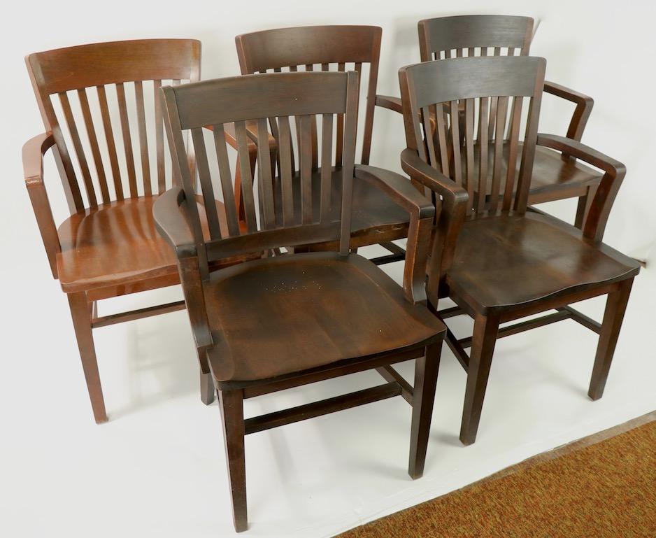 5 solid walnut office, or courthouse chairs some marked Gunkocke, some marked B.L. Marble, 4 are matched, one is very slightly different form, one is a shade lighter, as shown. Offered and priced individually, but we would love to see them stay