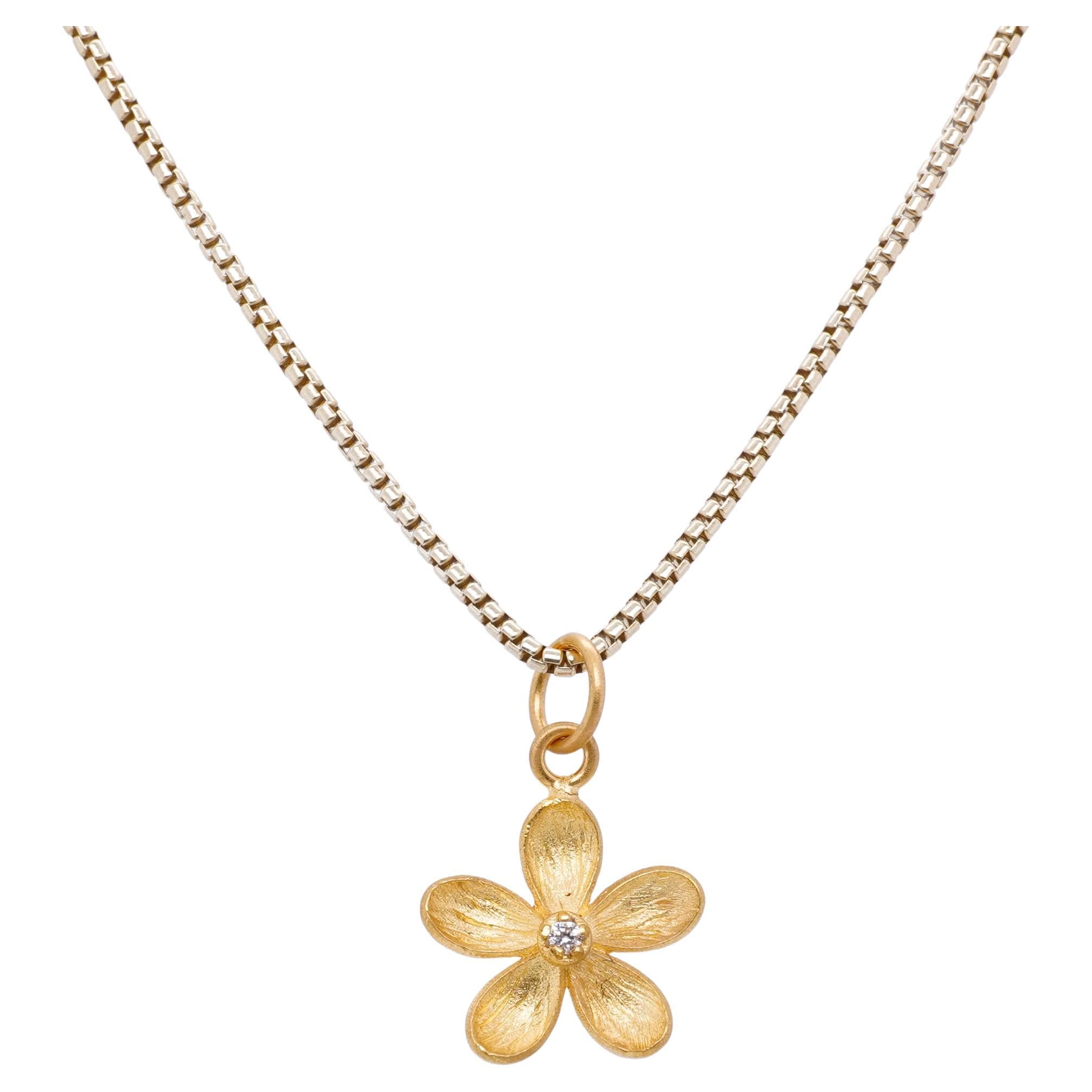 5 Petal Pentas Flower Charm Pendant Necklace with Center Diamond, 24kt Gold and Silver by Prehistoric Works of Istanbul, Turkey. Diamond - 0.01cts. These pendants pair well alone or with other coin pendants or with miniature pendants. Measures, 12mm