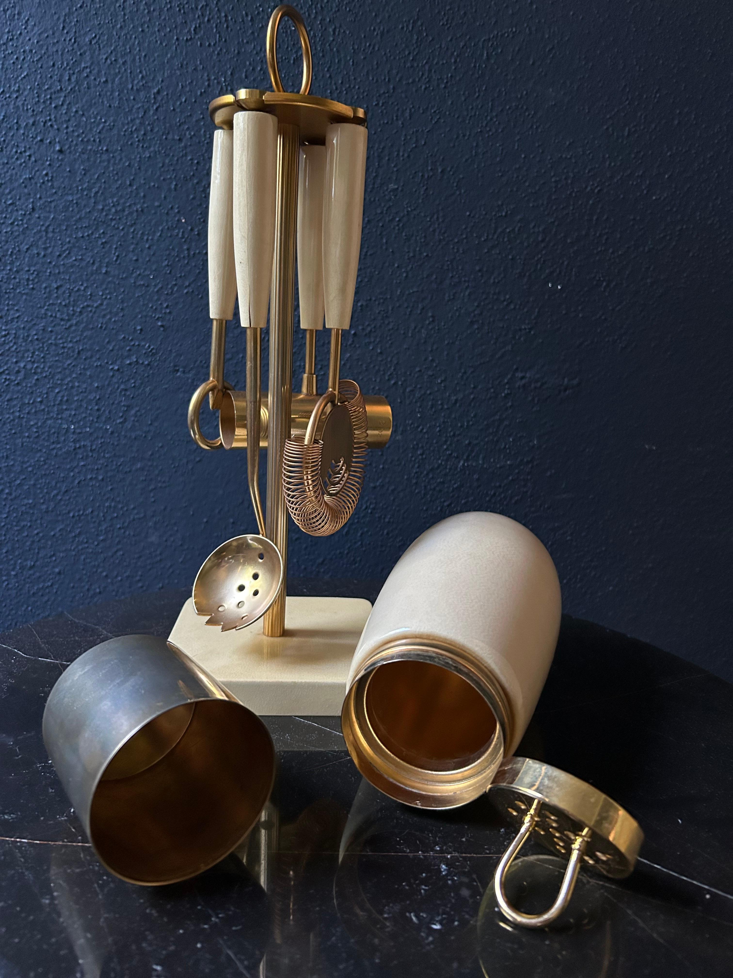 Please see our store for more Aldo Tura barware and bar carts!
 
Add a touch of La Dolce Vita to your home bar with this neat 5 piece mixing set by the Italian designer Aldo Tura, renowned for his lacquered goatskin bar carts and cabinets.