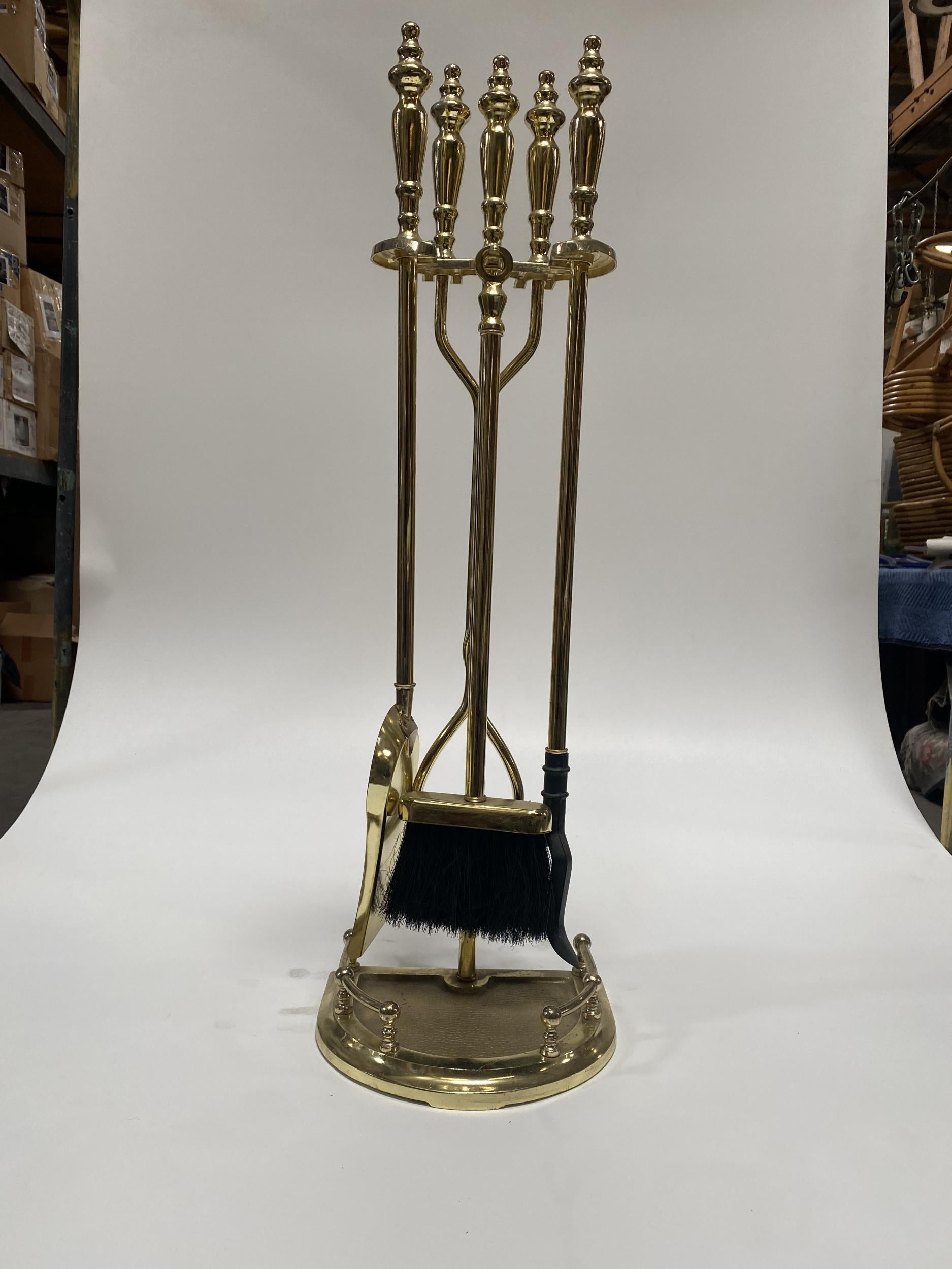 Vintage 1950s Colonial Fireplace solid brass tool set featuring a stand, brush, poker, shovel, and tongs.