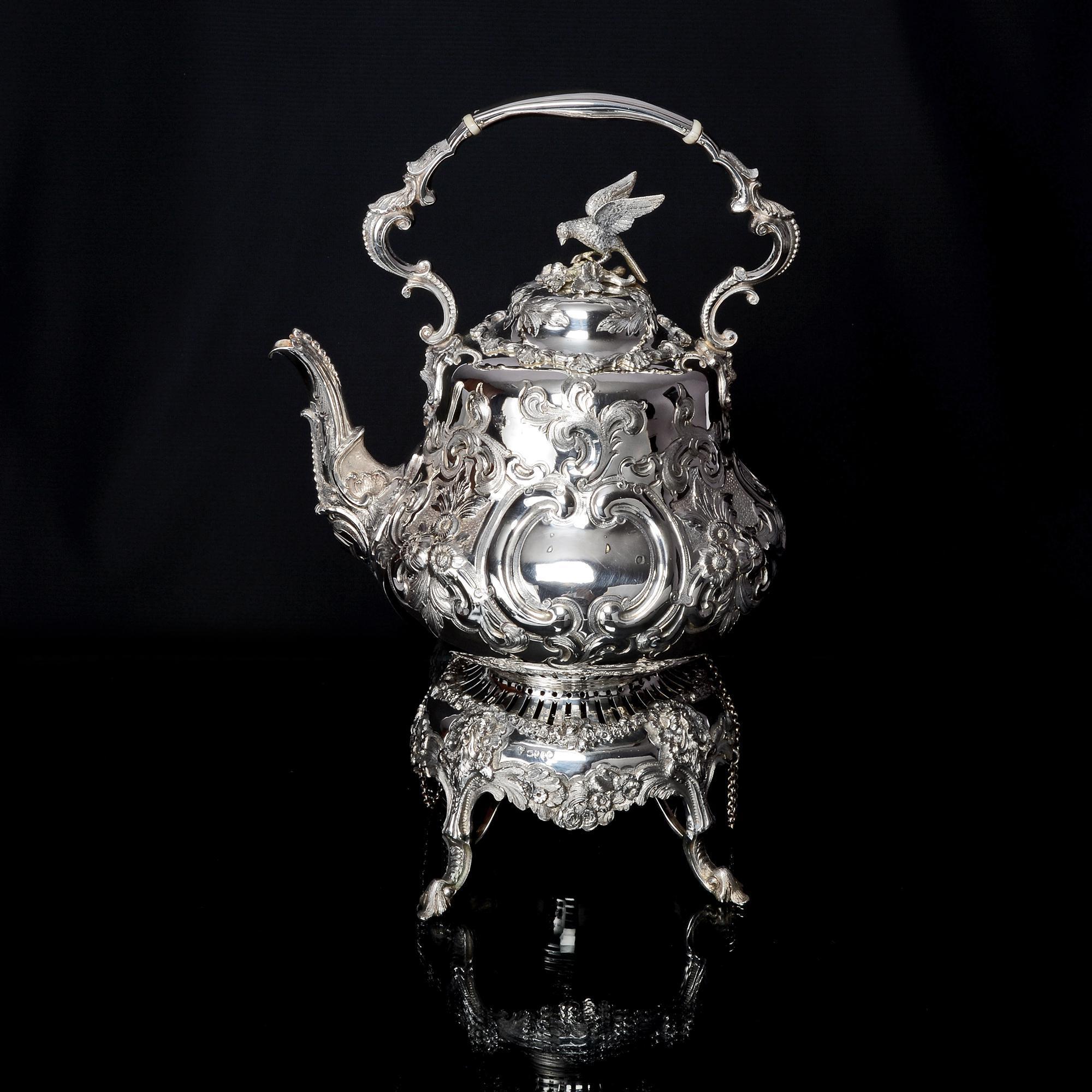 A superb quality antique silver five piece Louis pattern silver tea and coffee service comprising a kettle on its stand and fitted with a burner, a teapot, coffee pot, milk jug and sugar bowl. The latter two pieces have gilded interiors. The kettle