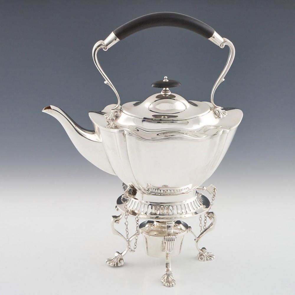 5 Piece Sterling Silver Tea and Coffee Set with Kettle Sheffield, 1912

A highly unusual set that of a kind we haven't sold before. The kettle stands atop a stand wherein is placed a small burner to be filled with methylated spirit and lit to heat