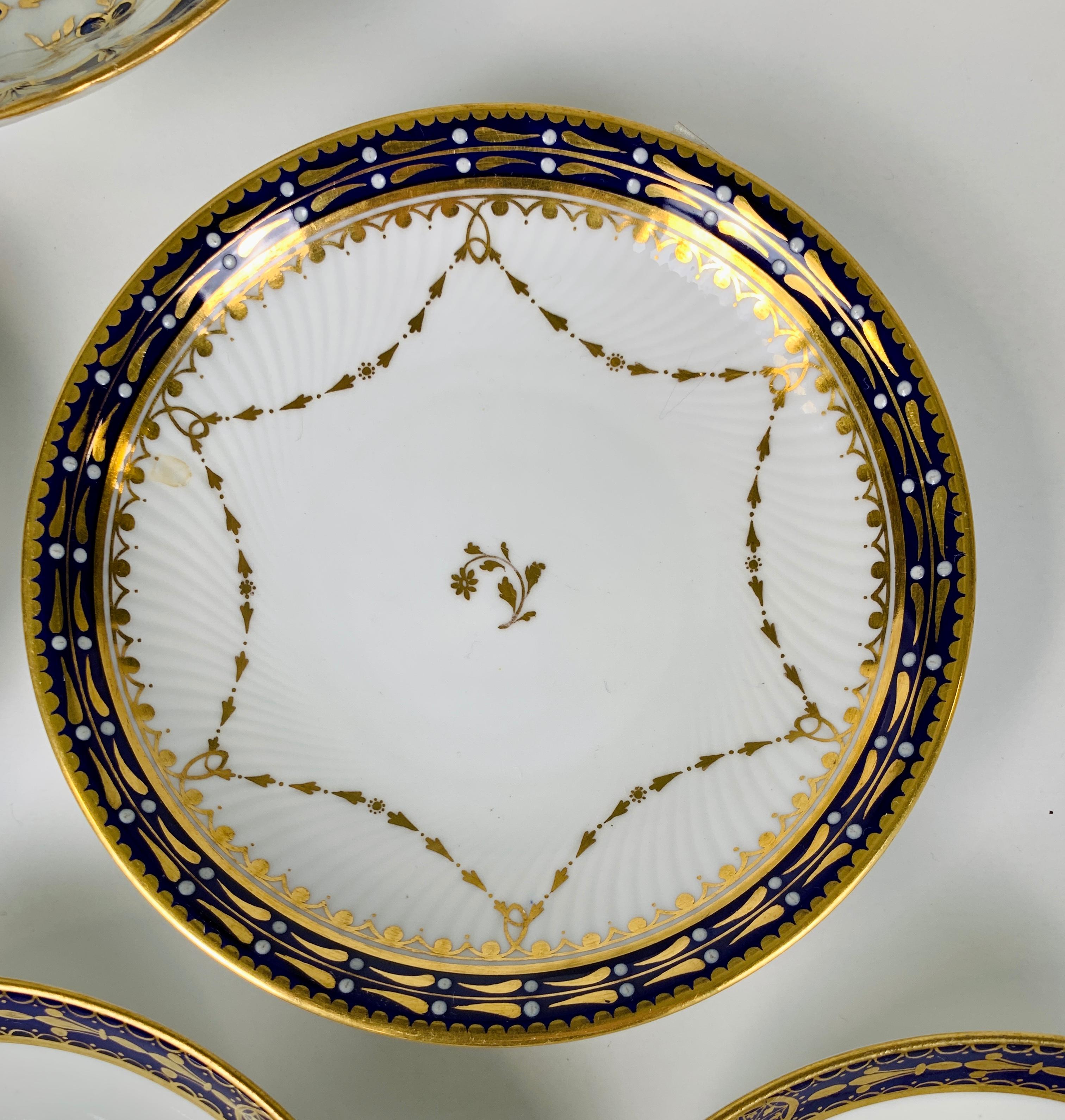 Six antique porcelain saucers with cobalt blue and gold borders were made in England in the late 19th century. The gilded decoration is simple and refined in the Regency style.
Dimensions: 5.25