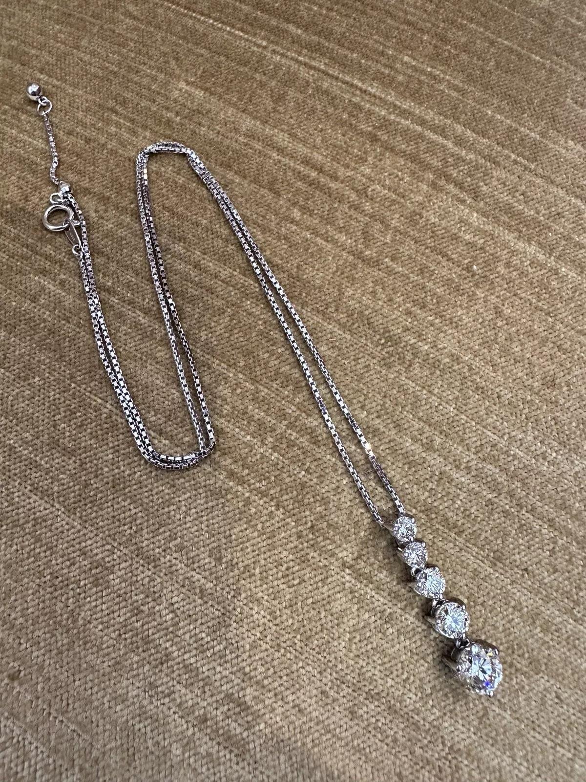 5 Graduated Diamond Journey Pendant Necklace 2.44 carat total weight in 18k White Gold

Natural Diamond Journey Pendant Necklace features 5 Natural Round Brilliant Diamonds graduating in size with weighing 2.44 carats in total, all set in an 18k