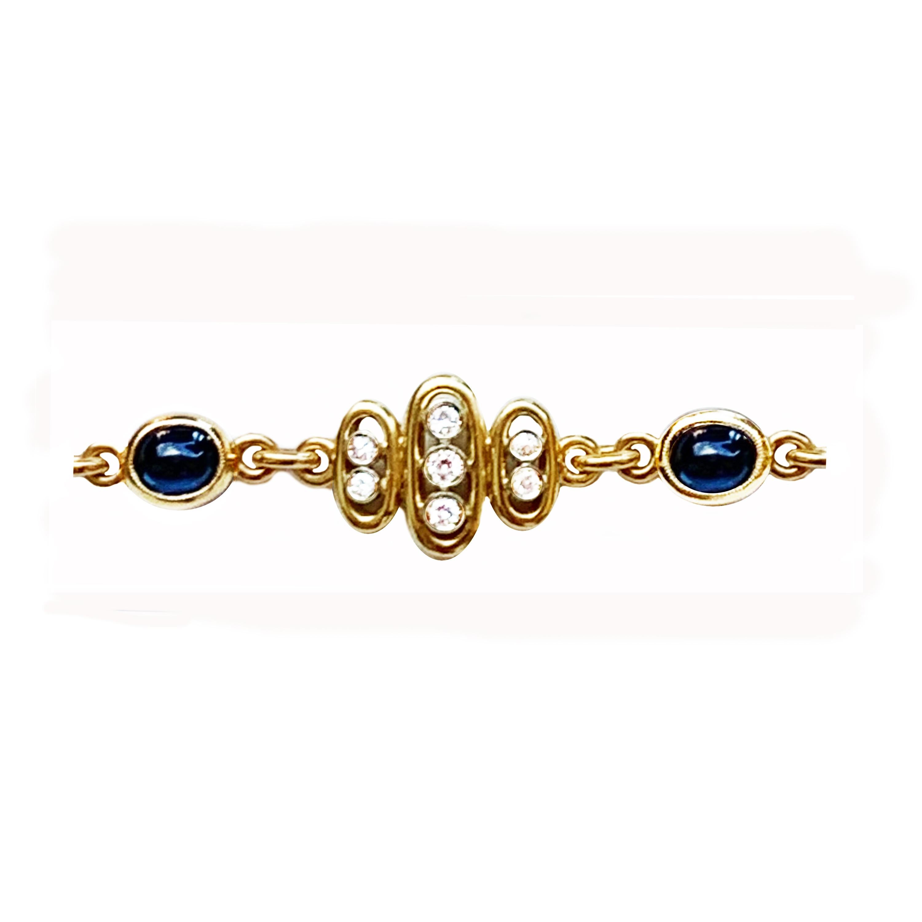 Refined white and yellow 18 Kt gold vintage sapphire and diamond bracelet. The bracelet is set with 5 natural beautiful cabochon sapphire 5 x 7 mm and 35 diamonds. It is completely handmade by skilled Italian artisans. 