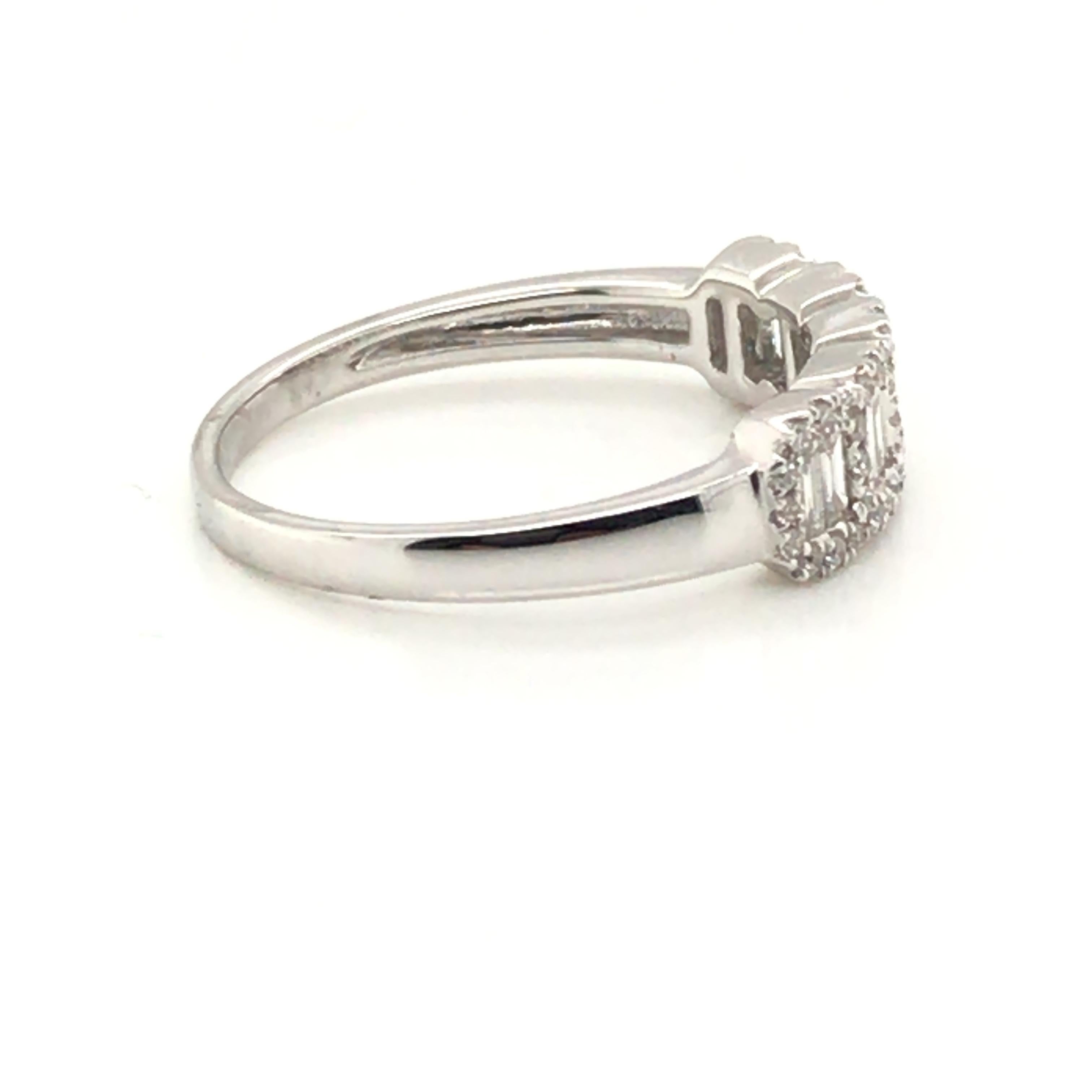 HJN Inc. Ring featuring a 5-Section Baguette Cluster Ring

Baguette-Cut Diamond Weight: 0.20 Carats
Round-Cut Diamond Weight: 0.20 Carats

Clarity Grade: SI1
Color Grade: G
Total Diamond Weight: 0.40 Carats
Polish and Symmetry: Very Good
Style