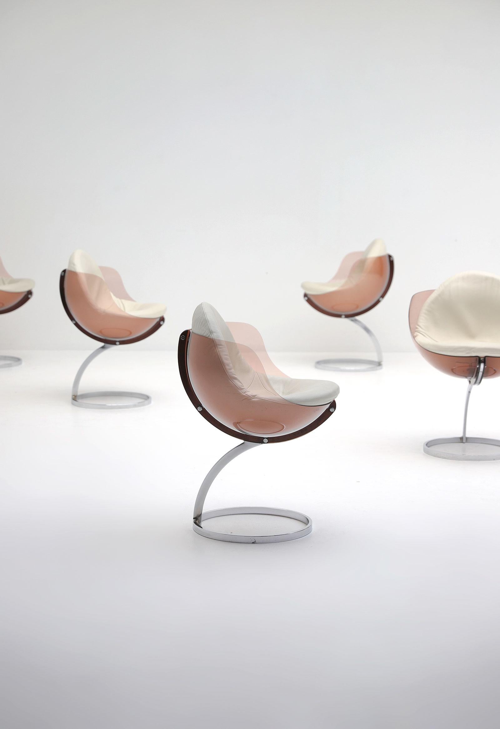 Set of five Sphere dining chairs by French designer Boris Tabacoff for Mobilier Modulaire Moderne 1971. This characteristic chairs have a smoked Plexiglas shell on a chromed steel arch structure terminated by a large circular base. The original