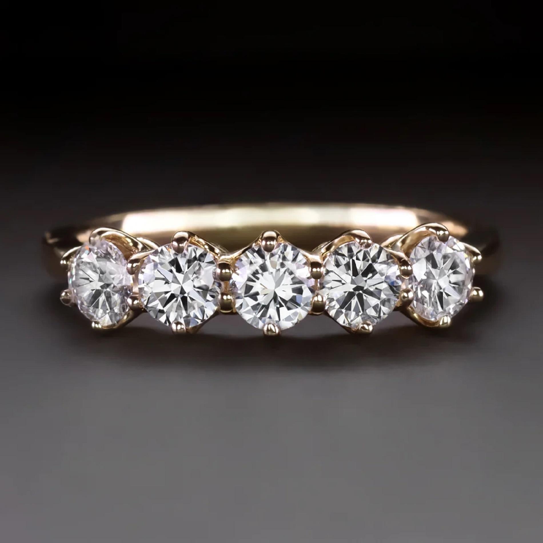 5 stone diamond band features 1 carat of glittering diamonds set in a classic 14k yellow gold design. The Victorian style buttercup settings add a touch of vintage charm and romance while maintaining a timeless aesthetic!

Highlights:

- Totaling 1