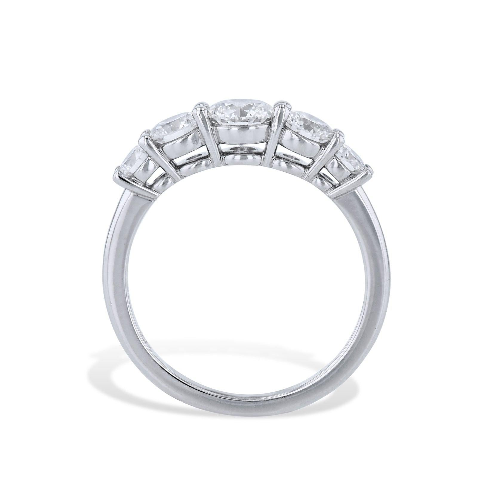 This exquisite 5 Stone Diamond Platinum Band Ring displays a captivating array of Diamonds. It features a center round brilliant cut diamond. Handcrafted with precision by H&H Jewels.
5 Stone Diamond Platinum Band Ring
Size 6
Platinum
Diamonds: