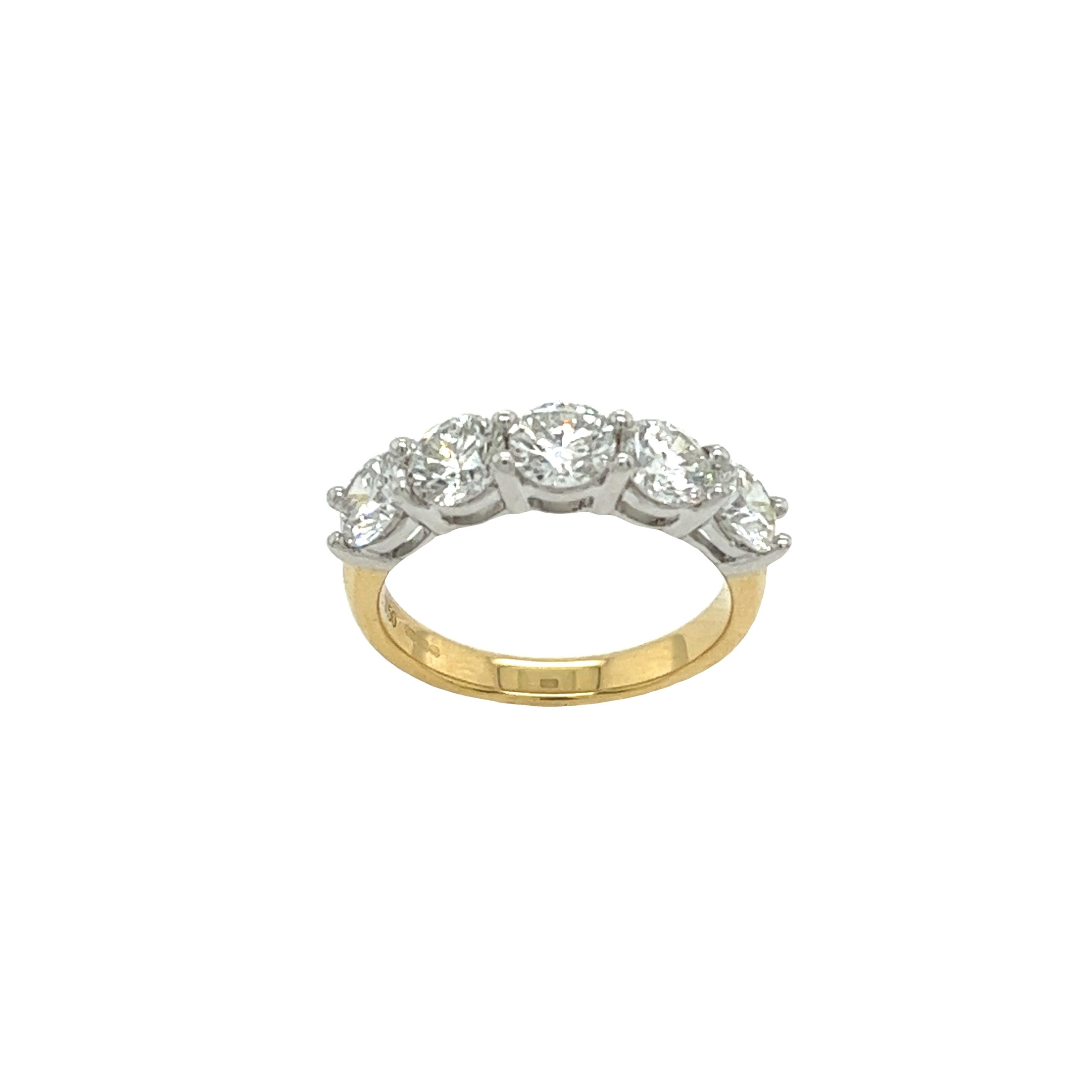 This magnificent diamond 5-stone ring
is set with 2.20ct G colour VS1 clarity round brilliant cut diamonds.
Set in yellow & white 18ct gold.
This ring is elegant and beautiful for a wedding ring or anniversary ring.
Total Diamond Weight: 2.20ct