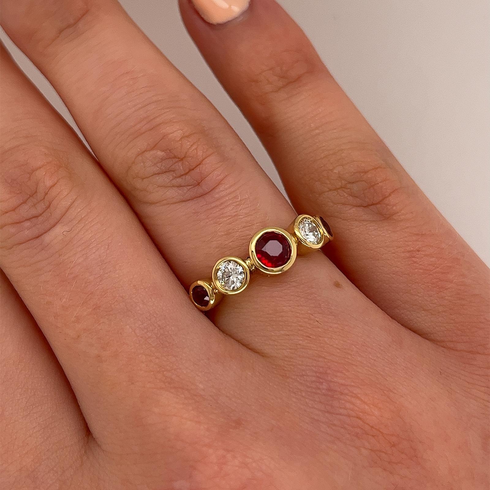 Add a touch of timeless elegance to your jewellery collection 
with this stunning 5-stone ring, expertly crafted in 18ct gold. 
Featuring two brilliant round diamonds and three vibrant rubies, 
this ring is the perfect blend of classic