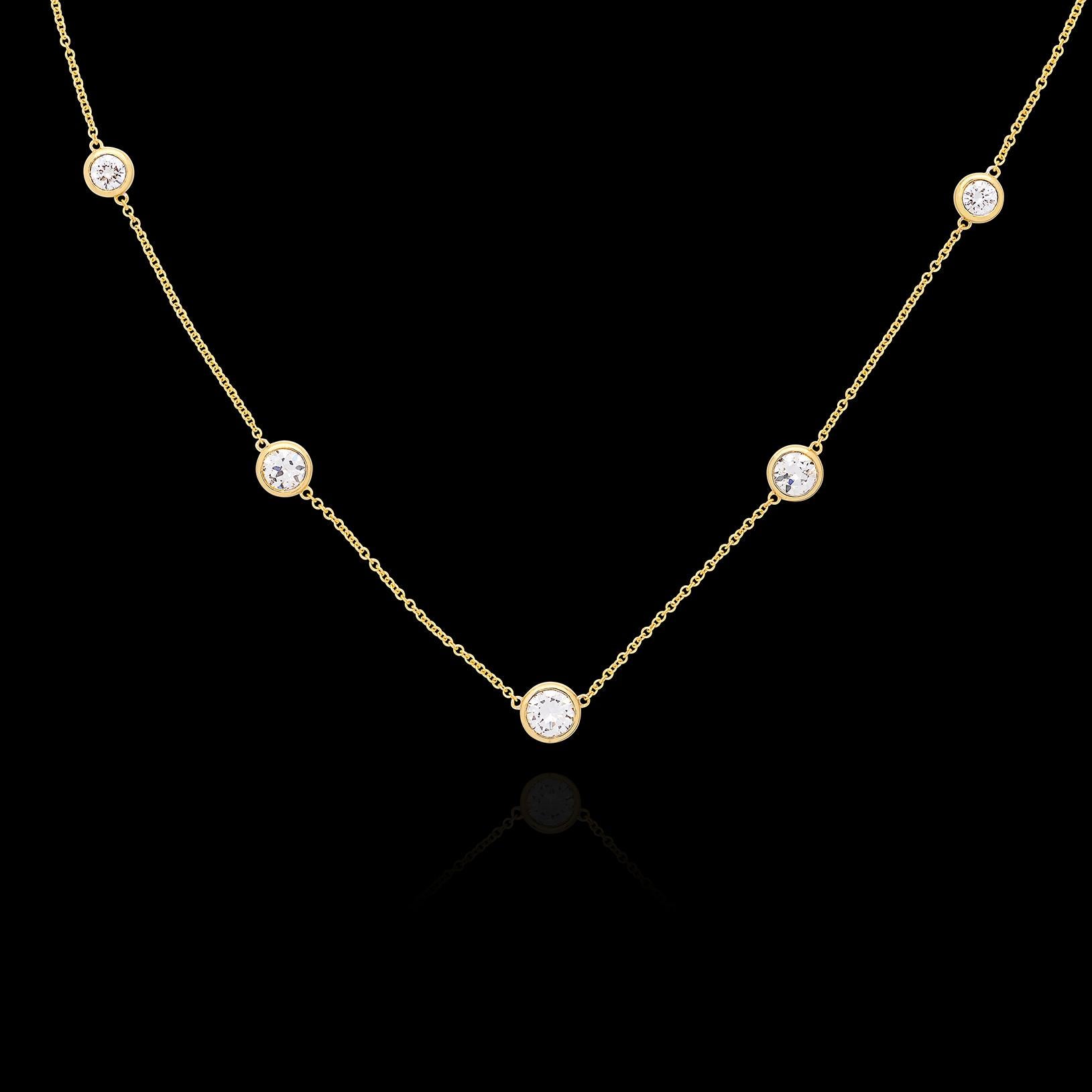 Classic beauty is always in style. This 18 karat yellow gold diamonds-by-the-yard necklace showcases 5 round brilliant-cut diamonds weighing in total 2.04 carats with the center diamond weighing approximately .70 carats on its own. The stones are