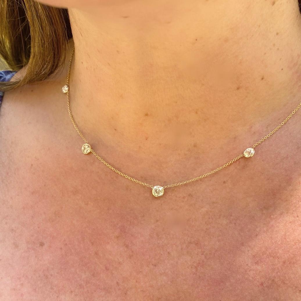 Old world beauty meets modern style in this classic piece featuring 5 repurposed antique diamonds. This 18 karat yellow gold diamond-by-the-yard necklace highlights 5 Old European Cut Diamonds weighing in total 2.40 carats with the center diamond