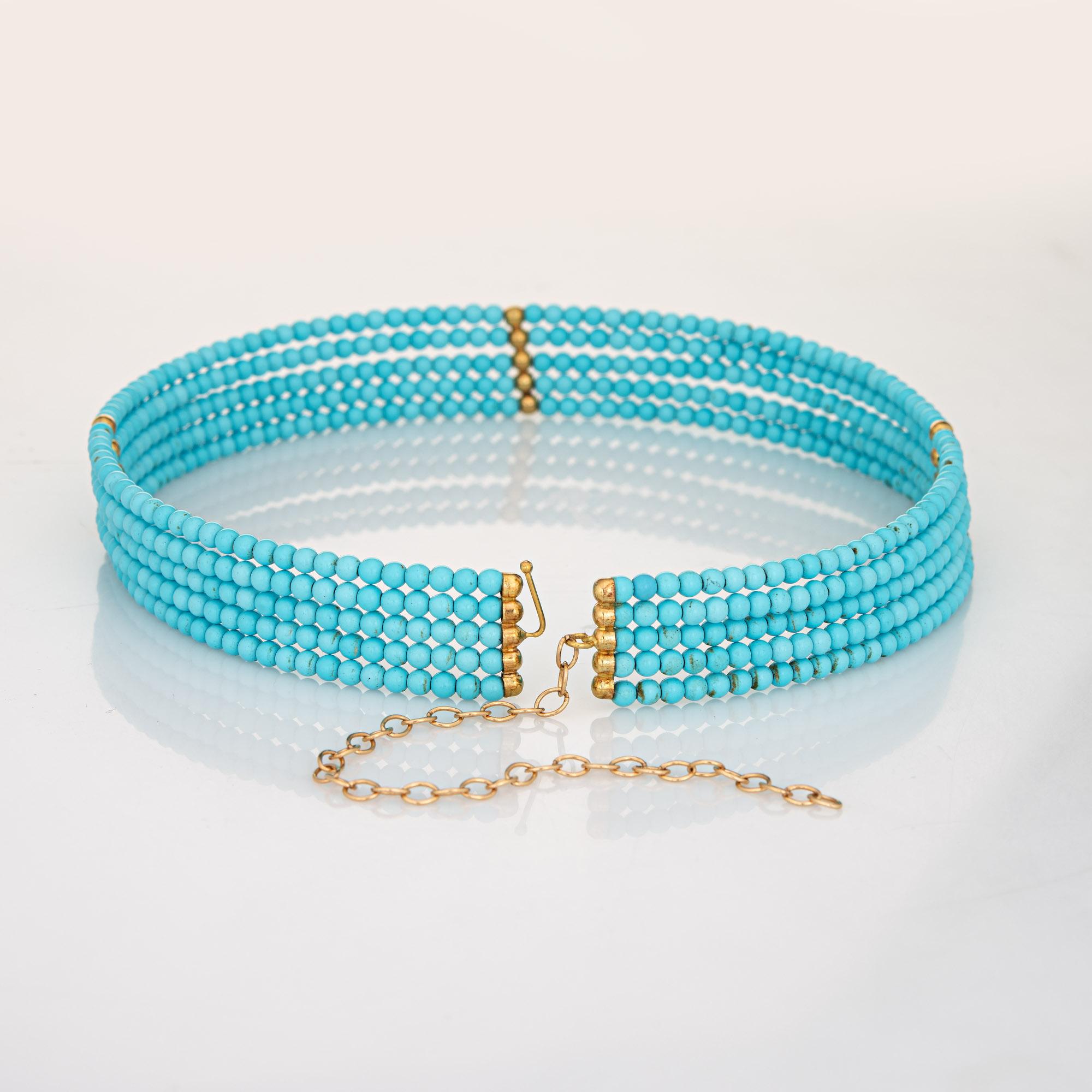 Stylish and finely detailed 5 strand turquoise necklace with 14k yellow gold stations.  

Stabilized turquoise beads are uniform in size and measure 3mm each. The stones are in very good condition and free of cracks or chips.   

The chalky light