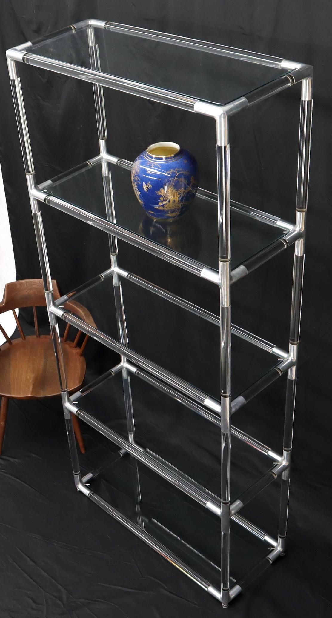 Mid-Century Modern Lucite and glass tall narrow shelving unit étagère.