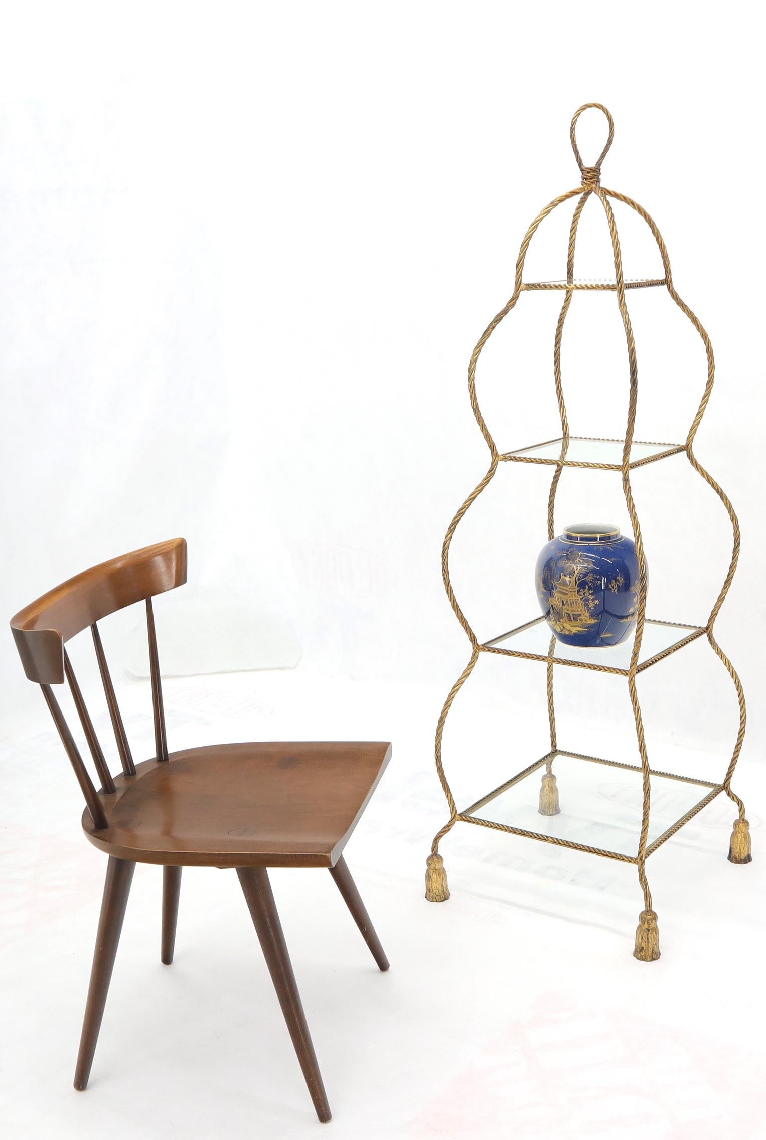 Italian Mid-Century Modern decorative twisted gilt metal rope étagère with glass shelves.