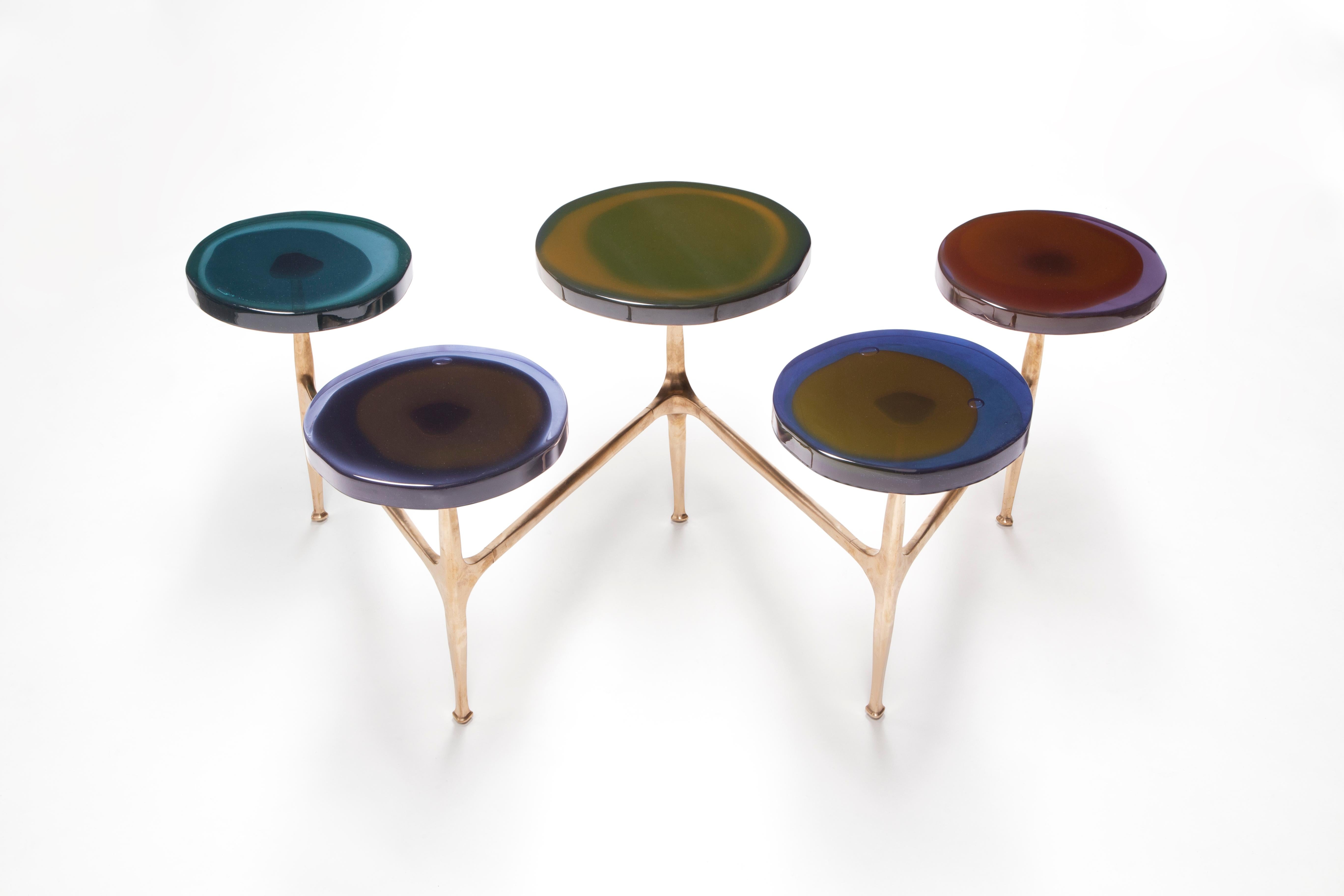 Agatha coffee table by Draga & Aurel
Dimensions: W 121 x D 80 x H 50 cm
 Top Ø 32/40 cm
Materials: Resin, bronze

The Agatha coffee tables are featured by irregular circular tops of transparent and
colorful resin sit on a bronze frame with a