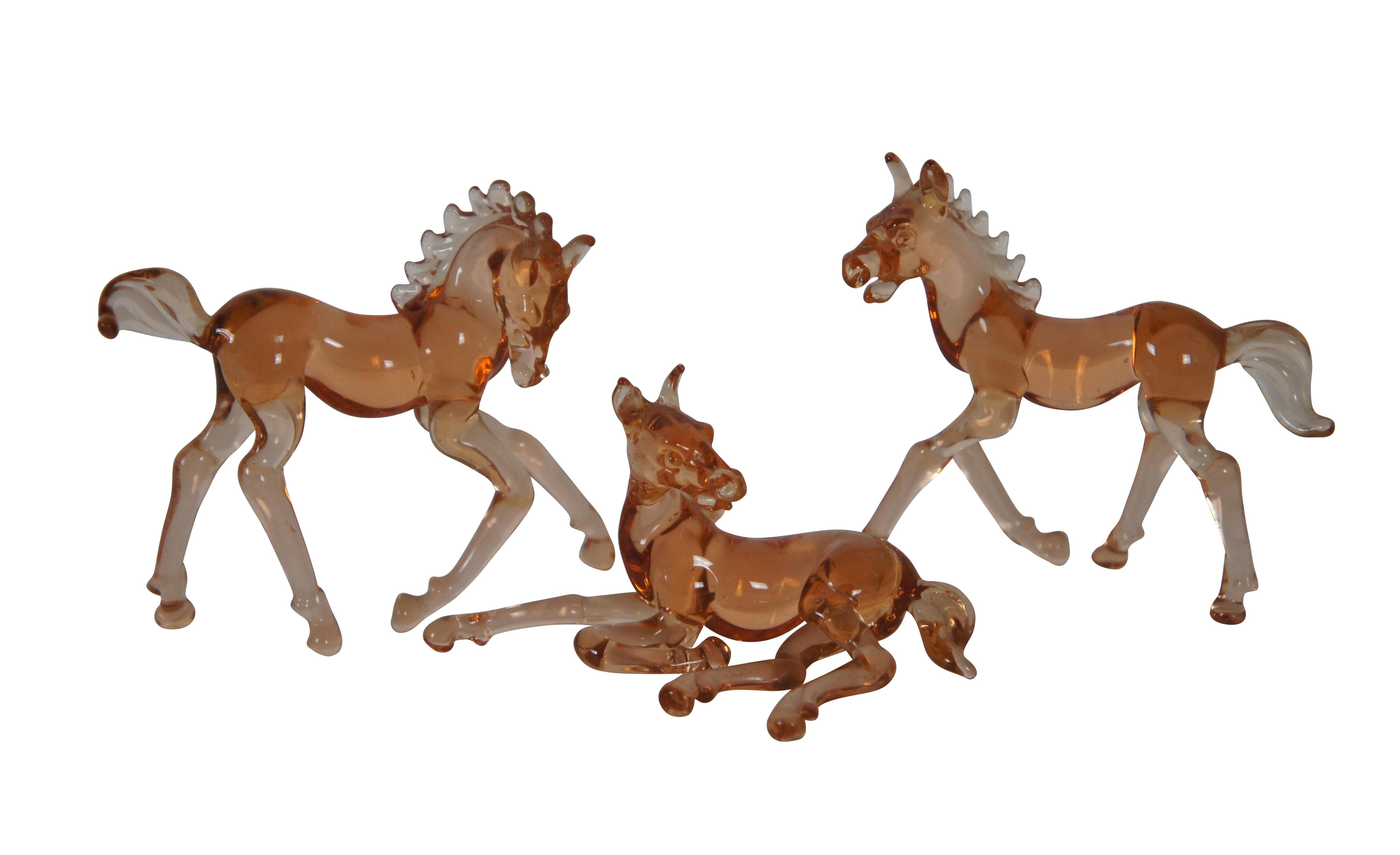 Seven vintage hand blown animals.  Made of amber art glass featuring three Horses and two Bengal Tigers.  Murano or German.

Dimensions:
Approx - 2.75” x 0.75” x 2.5” (Width x Depth x Height)
