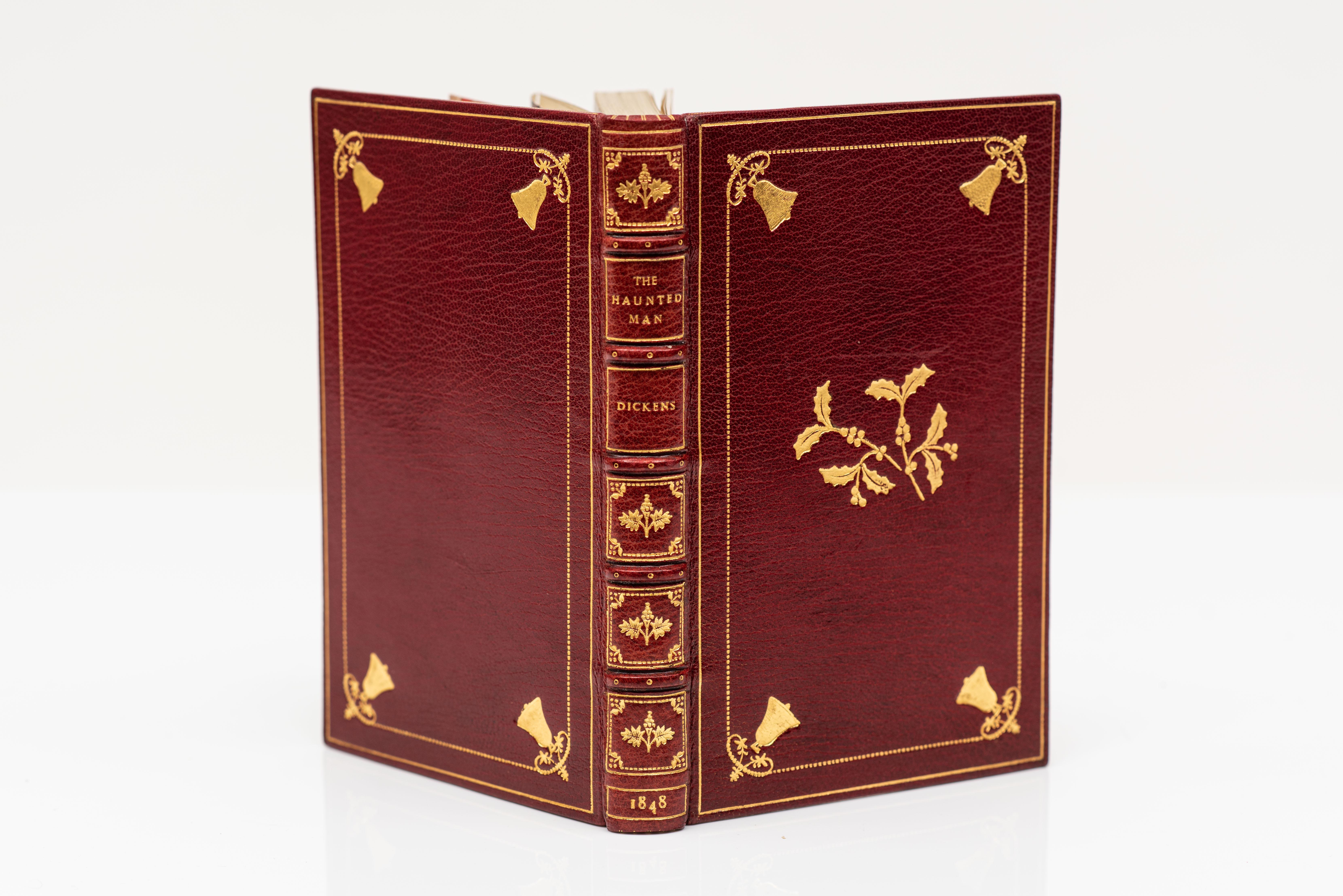 5 Volumes. Charles Dickens, The Christmas Books. All first editions. Bound in red morocco with gilt floral, bells, and holly decorations. Gilt-tooling on the raised band spines. Marbled endpapers. All edges gilt. Illustrated with engravings. London: