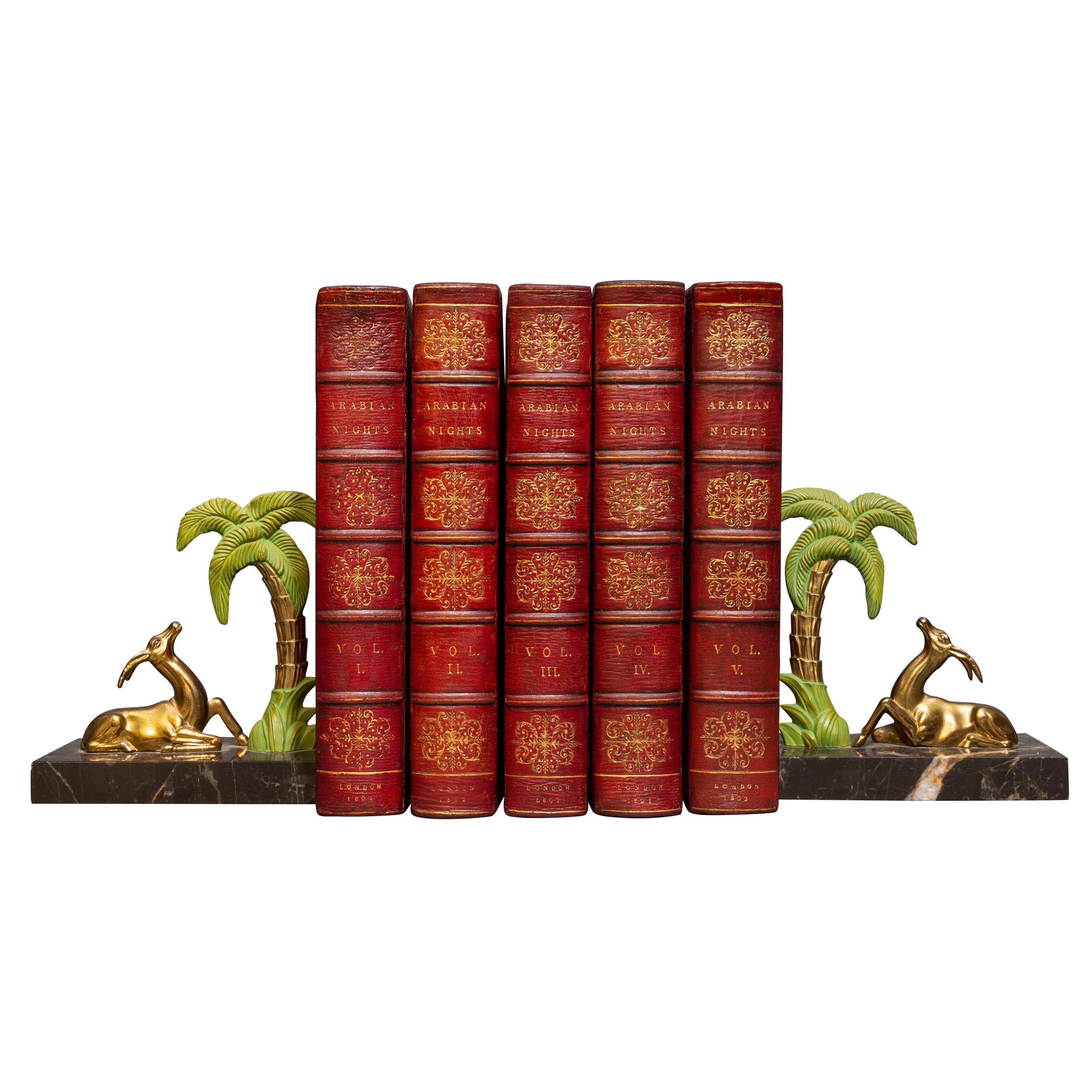 5 Volumes. Rev. Edward Forster. The Arabian Nights. Translated by Forester. With engravings from pictures by Robert Smirke. Bound in full red morocco. Ornate gilt on spines and ocvers. Raised bands, all edges gilt, inner dentelles, marbled