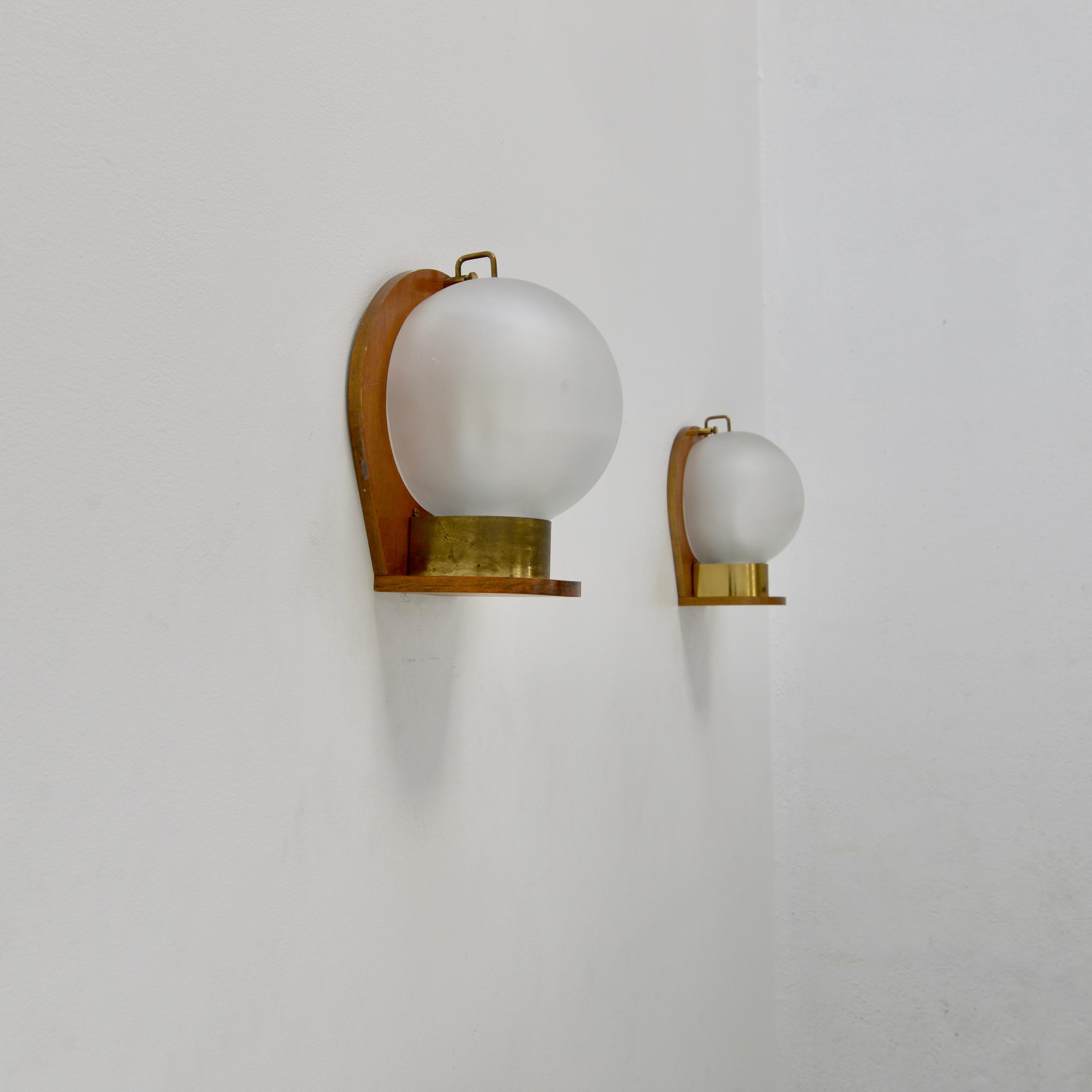 Wonderfully rustic wood and brass glass sconce from 1950s Italy. Original finish and satin clear glass. Partially restored with (1) E26 medium based socket per sconce. Wired for use in the US. Lightbulb included with order. 
Measurements:
Height