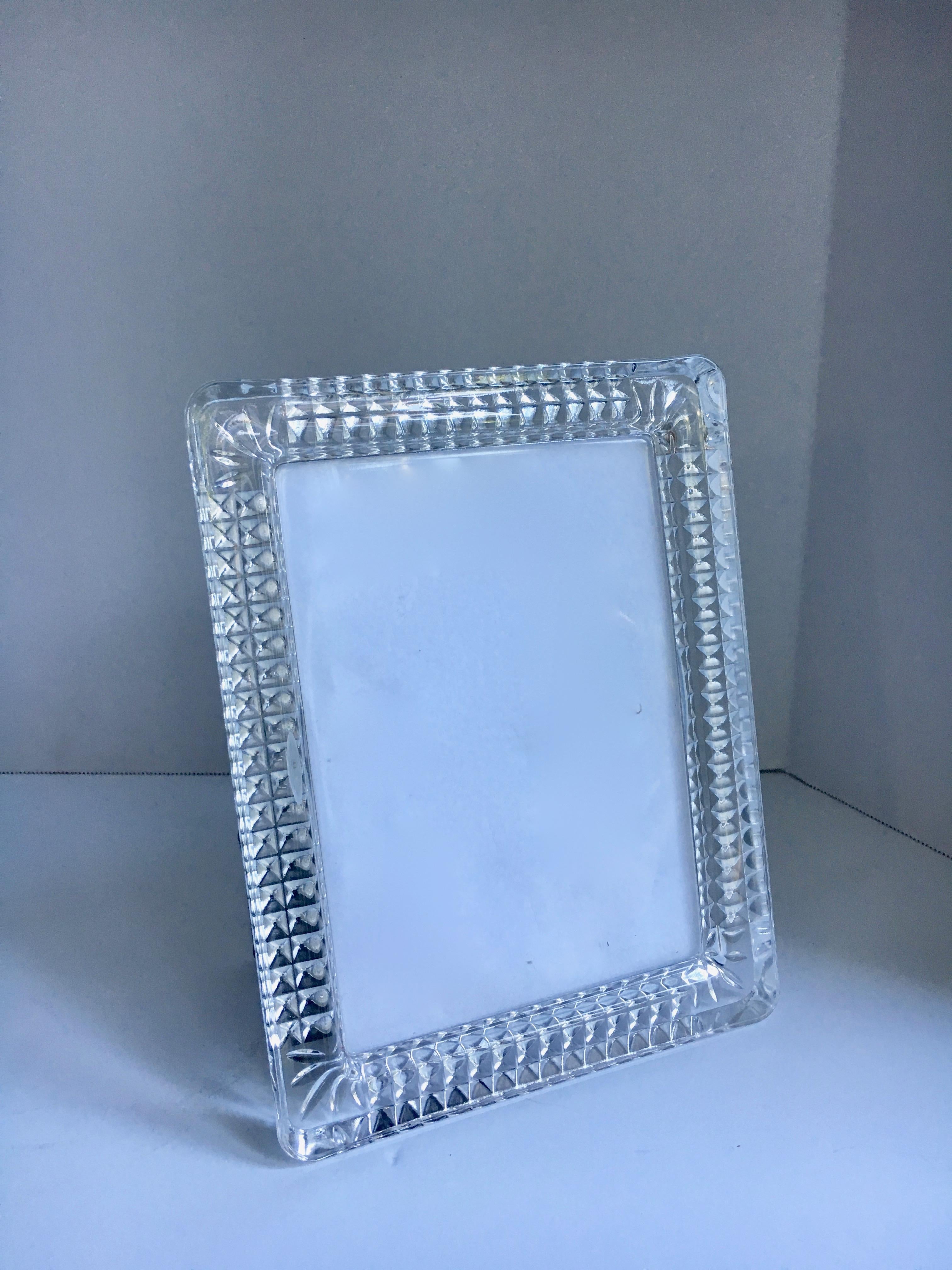Cut crystal Rosenthal picture frame - Crystal cut in the rear perimeter, with beautiful architectural design shining through, the glass covering the photo is molded into the frame and not a separate piece of glass. Unique and faceted.
The stand in