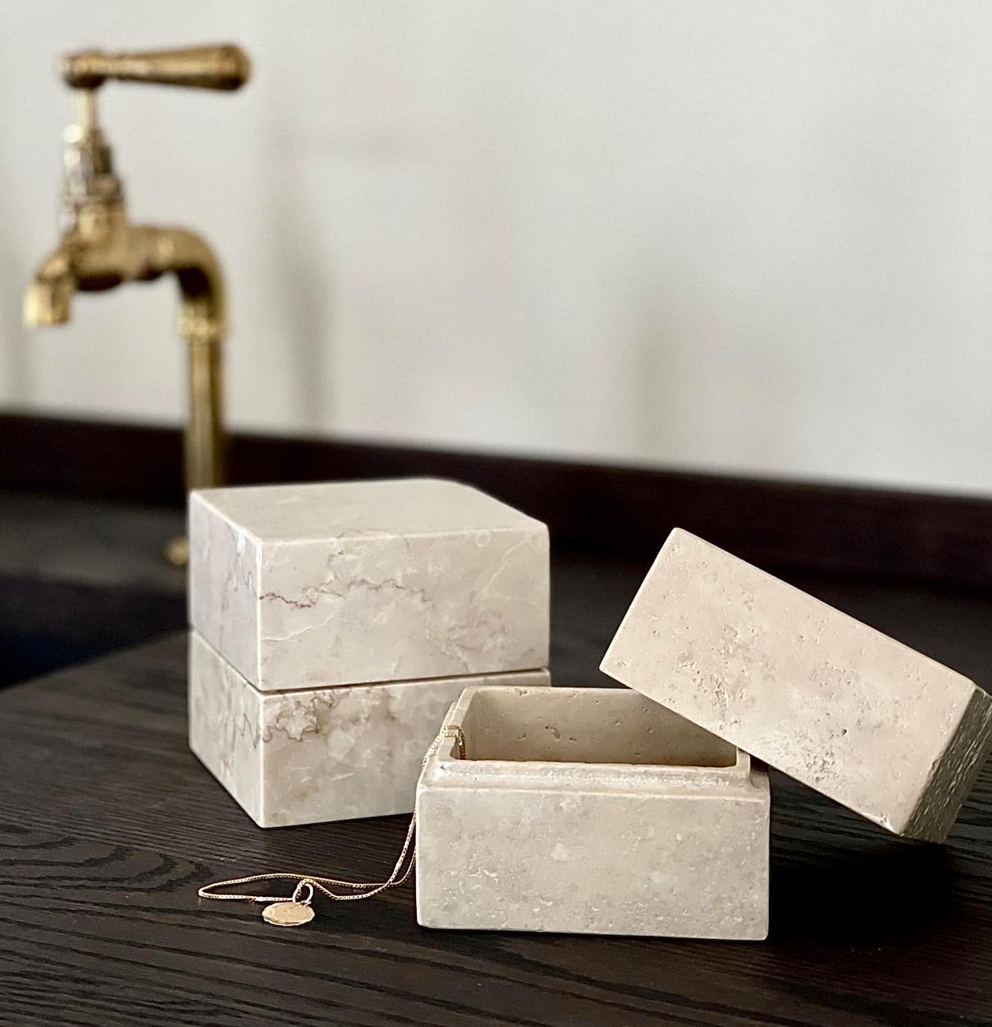 A limited production, functional object d'art exclusively produced by Anastasio Home.

The 50/50 is a perfectly imperfect four inch cube box, cut from a single piece of solid stone, and hand-finished by artisans in a growing stone atelier in