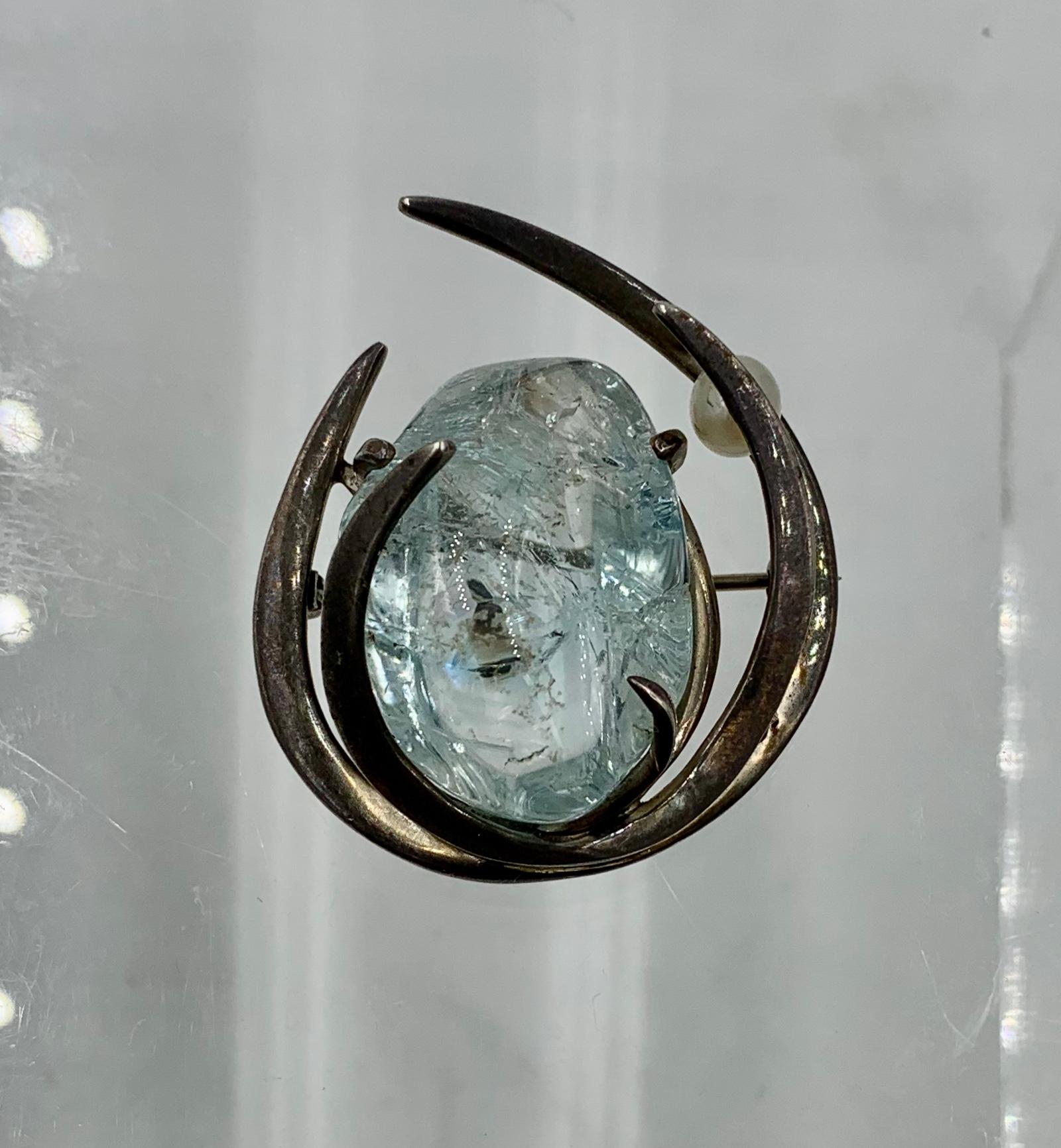 An absolutely magnificent monumental approximately 50 Carat natural mined Aquamarine Brooch in silver with dramatic Mid-Century Modern design with an accent pearl.  The brooch is a testament to the stunning design of the Retro Mid-Century period. 