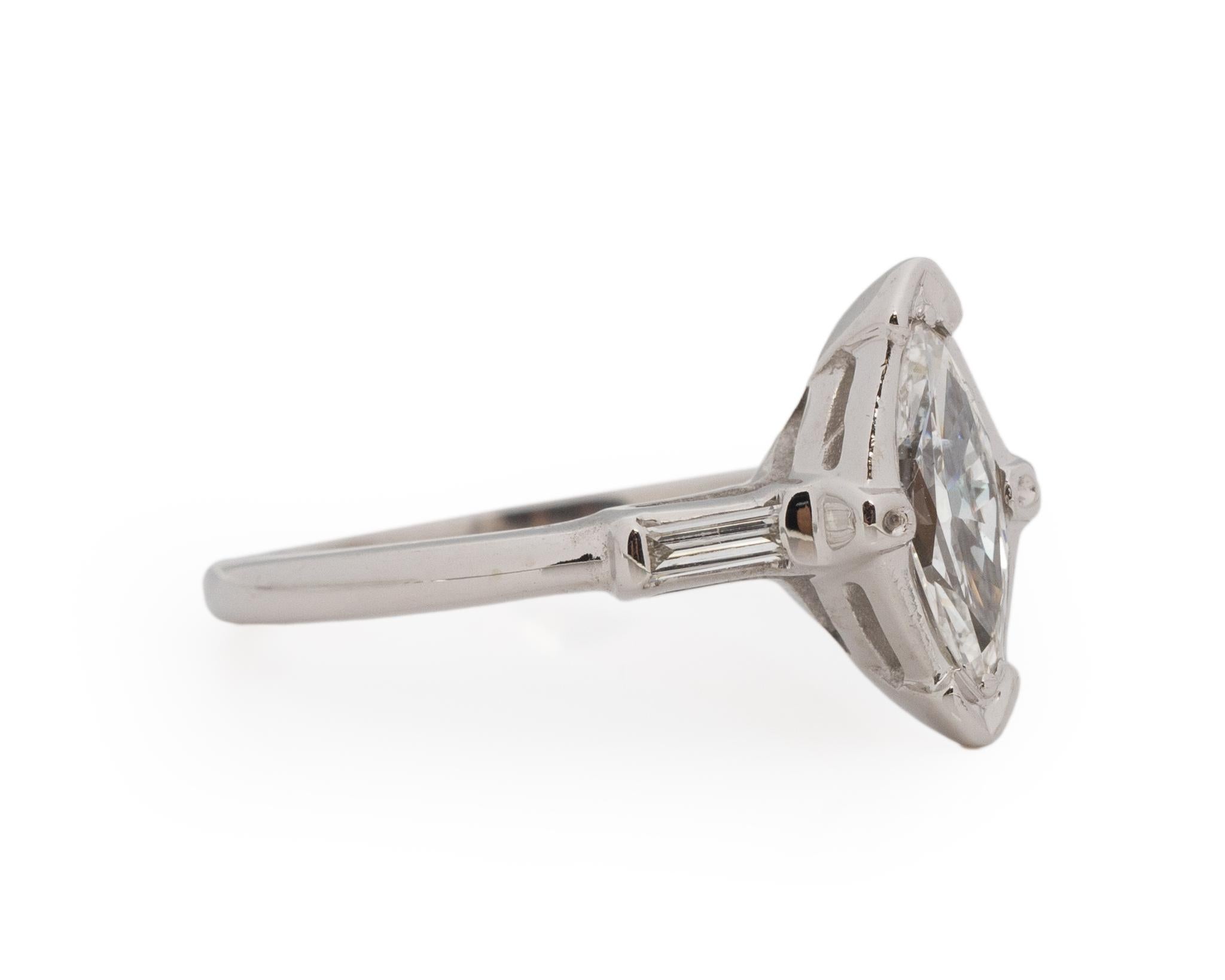 Ring Size: 6
Metal Type: Platinum [Hallmarked, and Tested]
Weight: 2.5 grams

Center Diamond Details:
Weight: .50ct
Cut: Antique Marquise
Color: F
Clarity: VS

Side Stone Details:
Weight: .25ct, total weight
Cut: Antique Straight Baguette
Color: